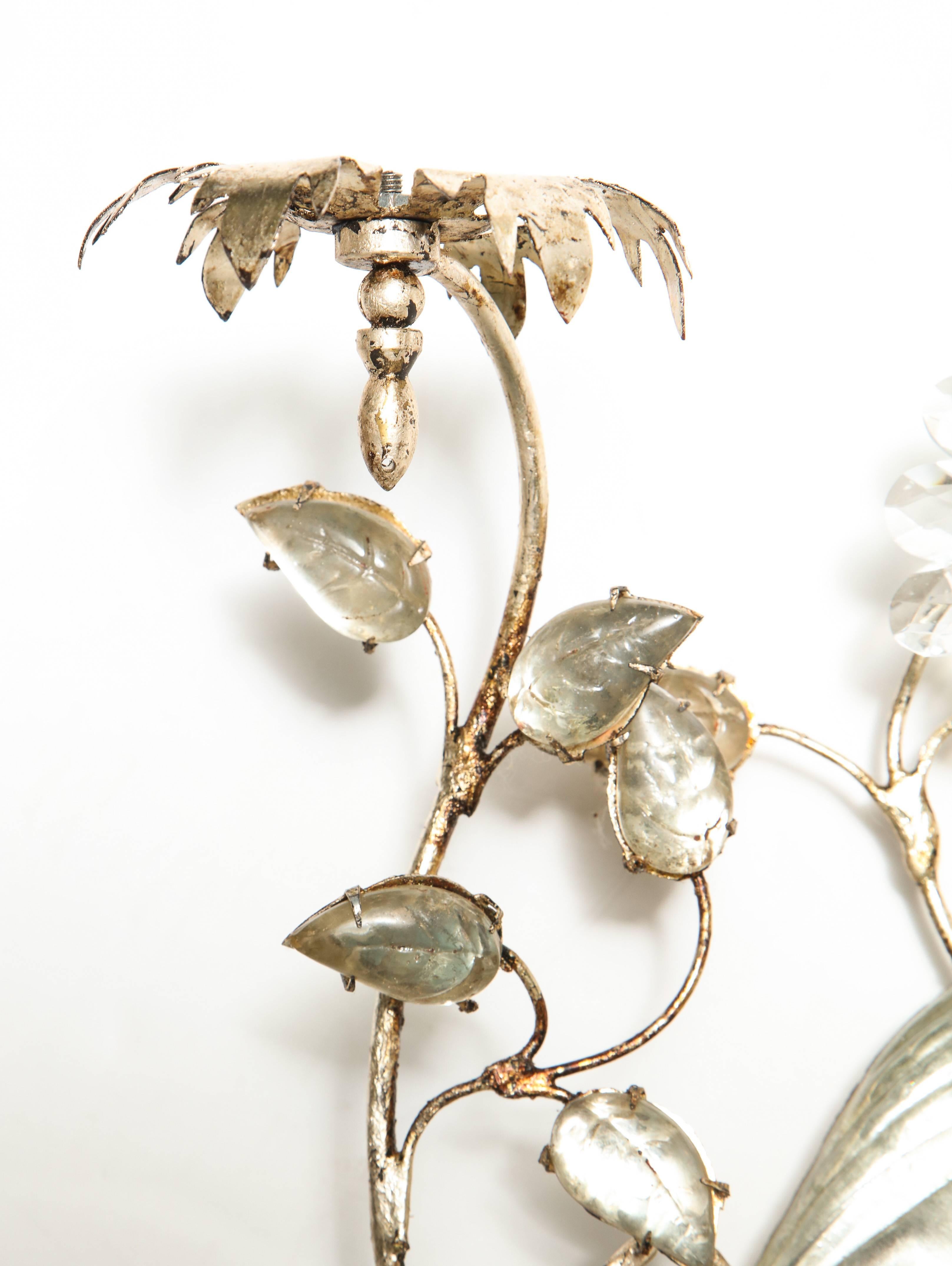 A fabulous pair of poured glass Maison Bagues sconces in the form of a birds sitting on a floral branch. Silvered gilded metal leaves and flowers weave extend from an elongated vase. These are now electrified with 2 candle fittings each sconce. 