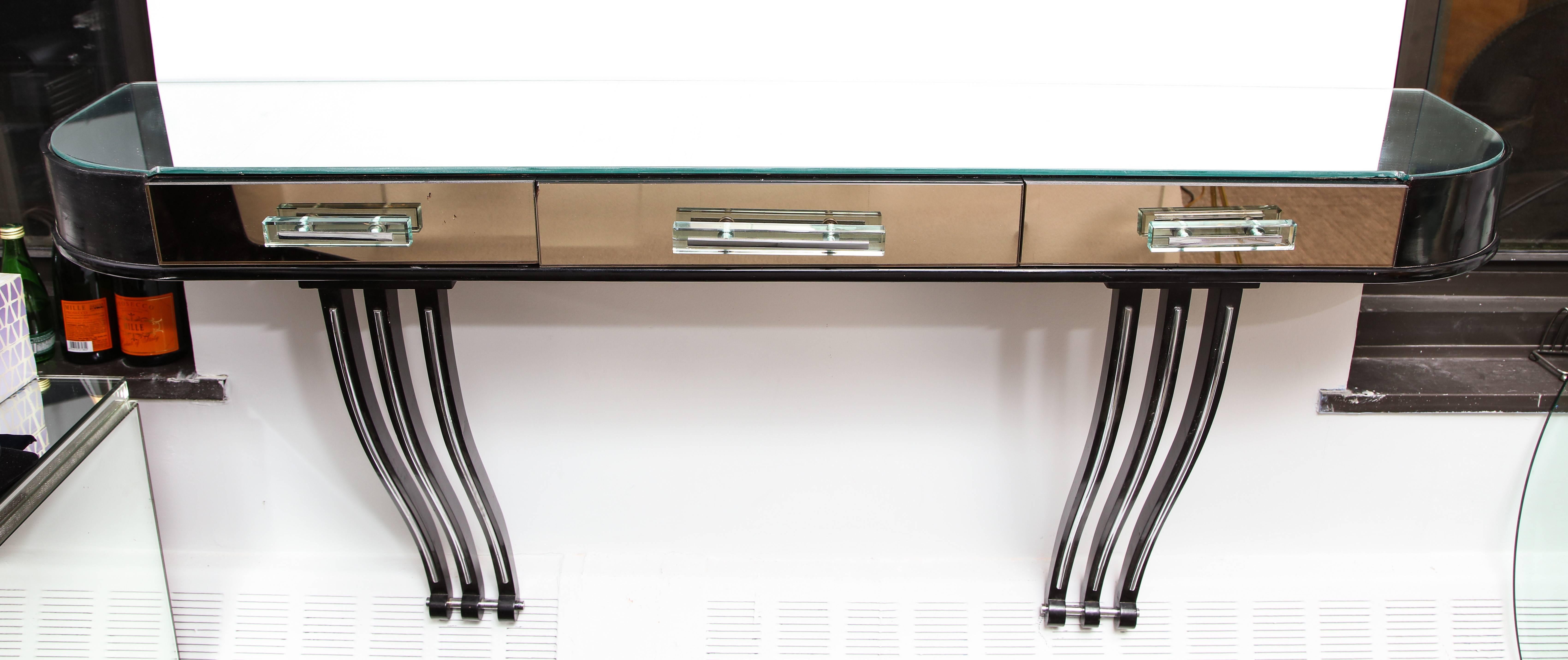 A stunning mirrored wall console  with glass handles and lacquered frame 
Three drawers with good depth to accommodate accessories
A great entrance piece.