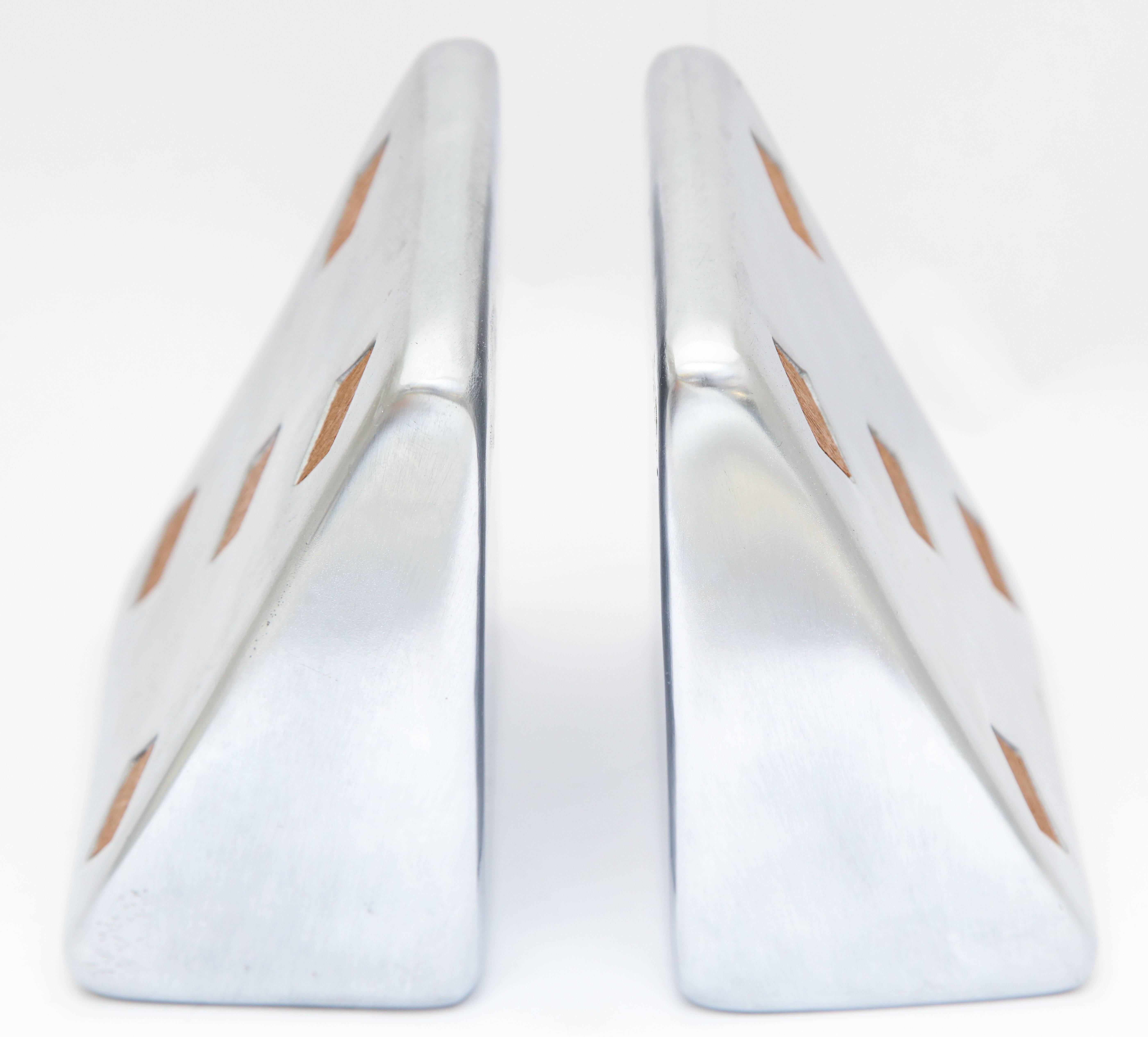 These silver plated metal bookends are a great design
from the 1950s. These have their original paper label which makes
them interesting. Designed by Ben Seibel.