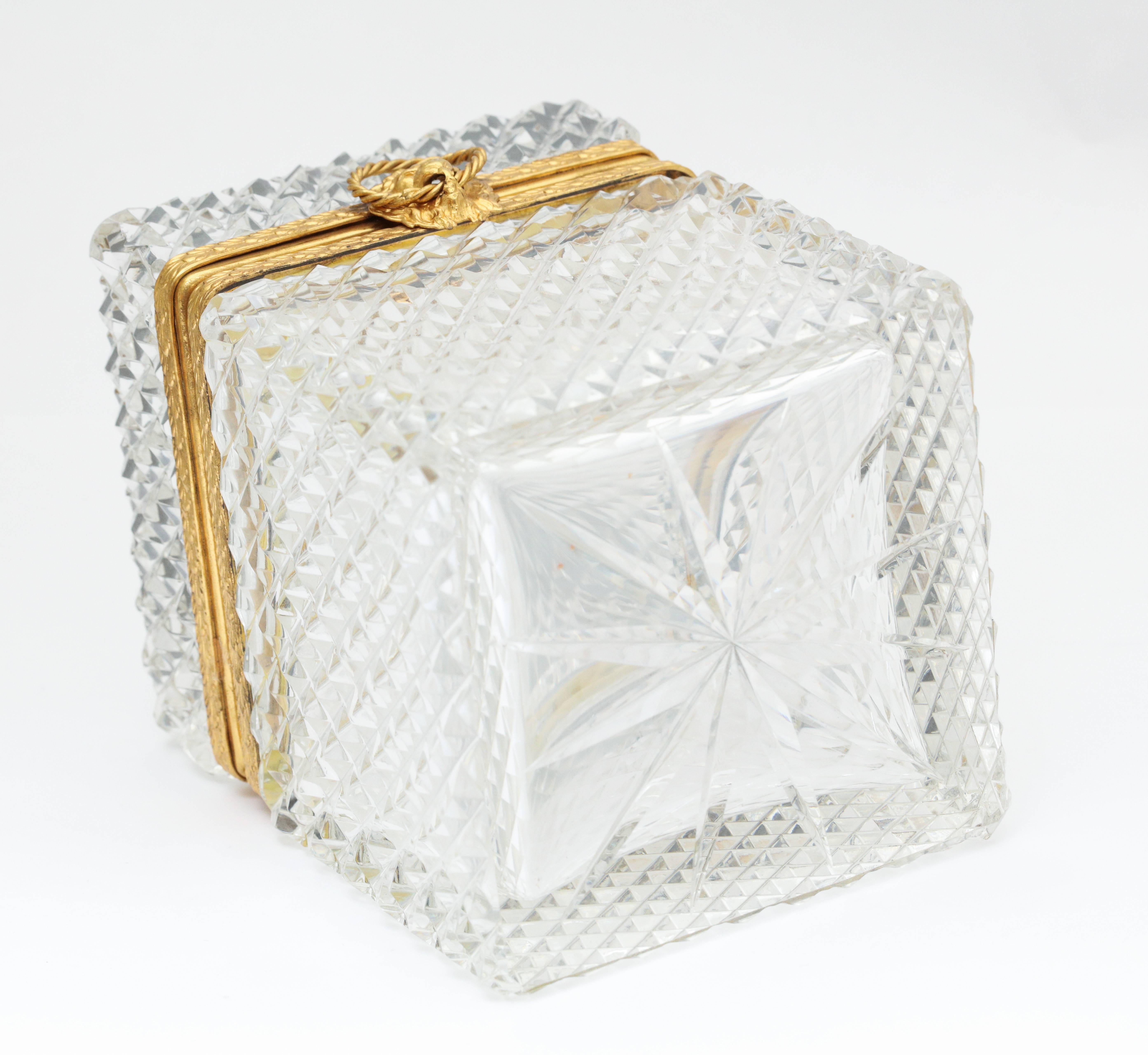 A wonderful crystal box with brass lion head clasp and trim.
