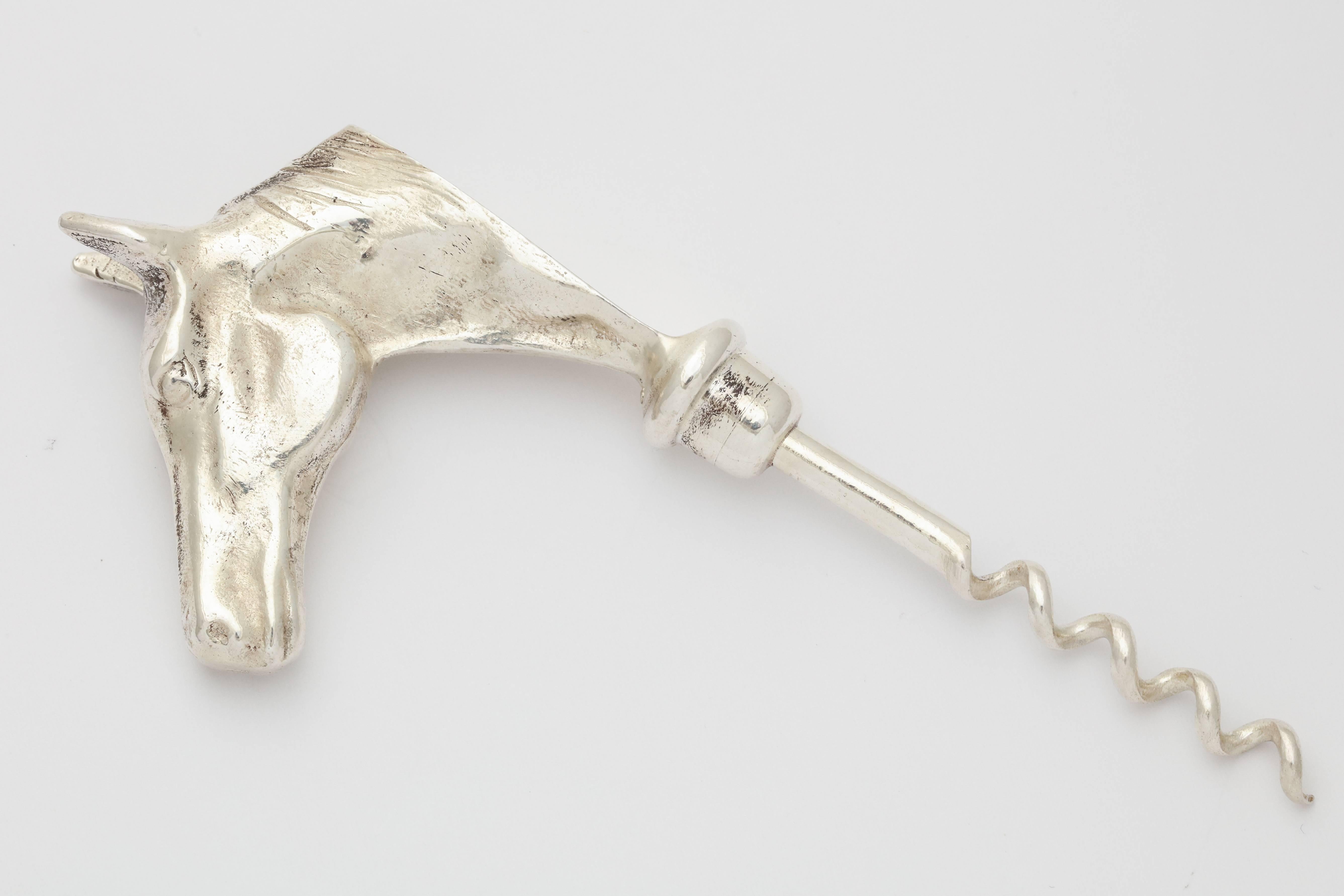 A great Hermes bottle opener corkscrew in the form of a corkscrew in silver plate with Hermes mark.