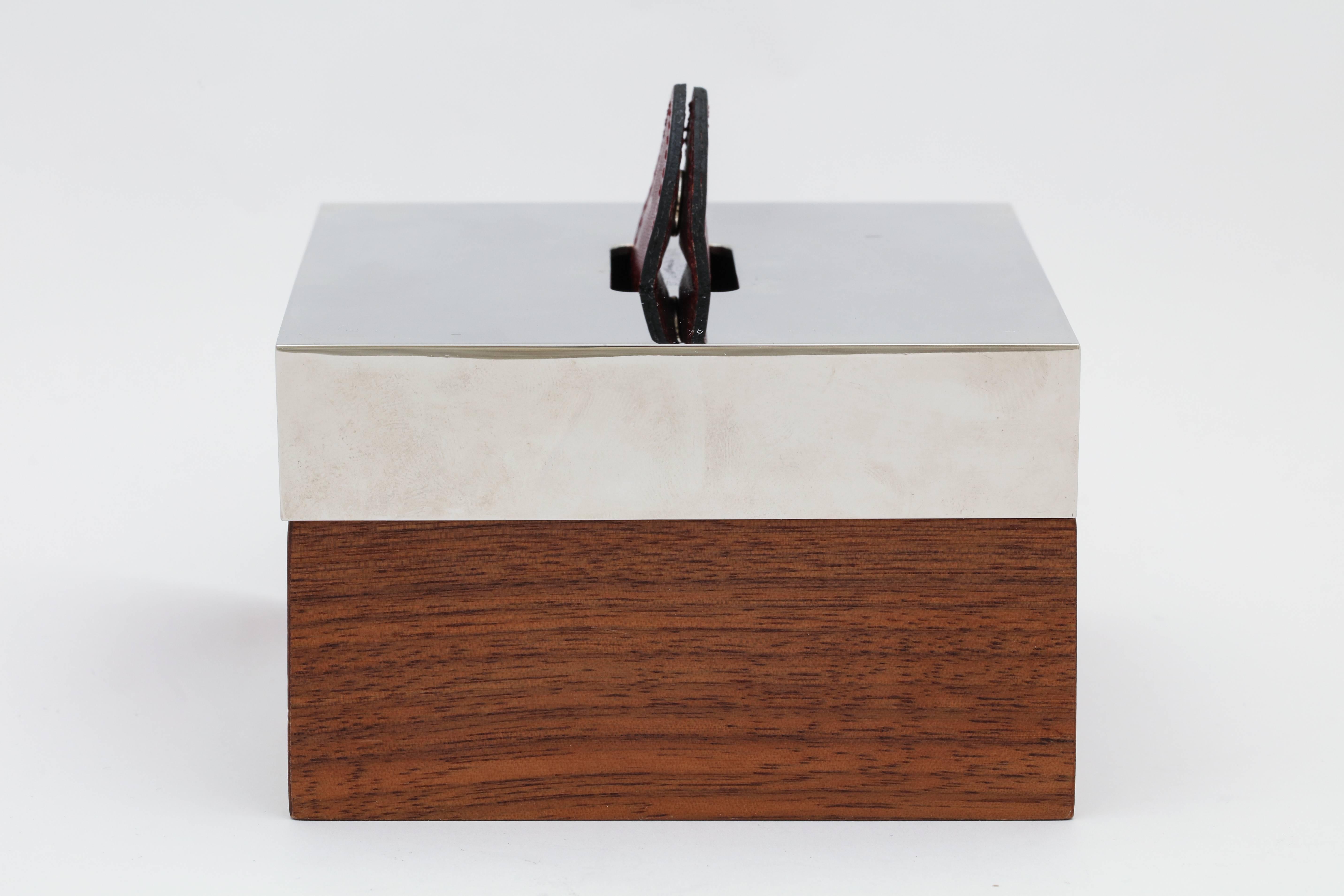A classic handsome design  leather, wood and silver plated box byHermes.