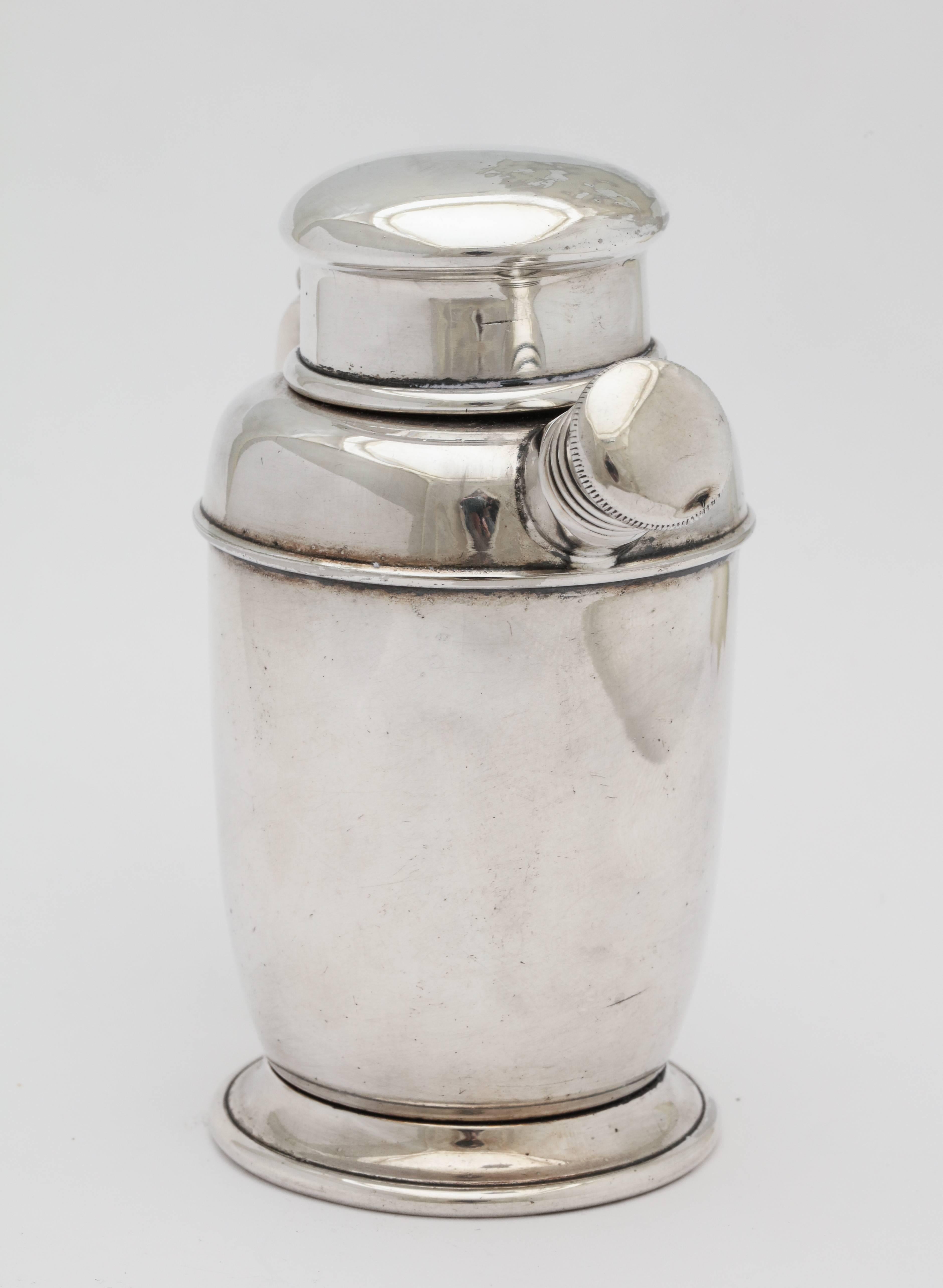 This collectible lighter is a charming conversation piece for any cocktail table or bar cart..
It is silver plate and requires flint and a wick, circa 1950s.