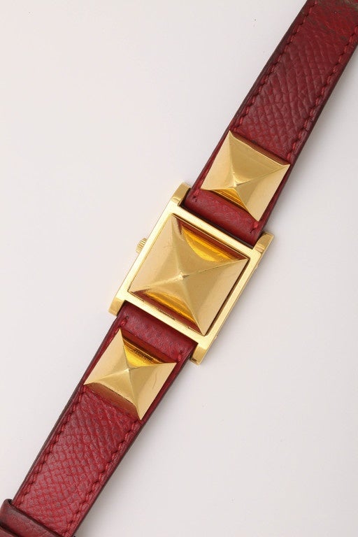 A stylish vintage Hermes Medor watch with red strap and flip cover. Authentic Hermes markings.
The strap is original but can easily be changed by Hermes.
