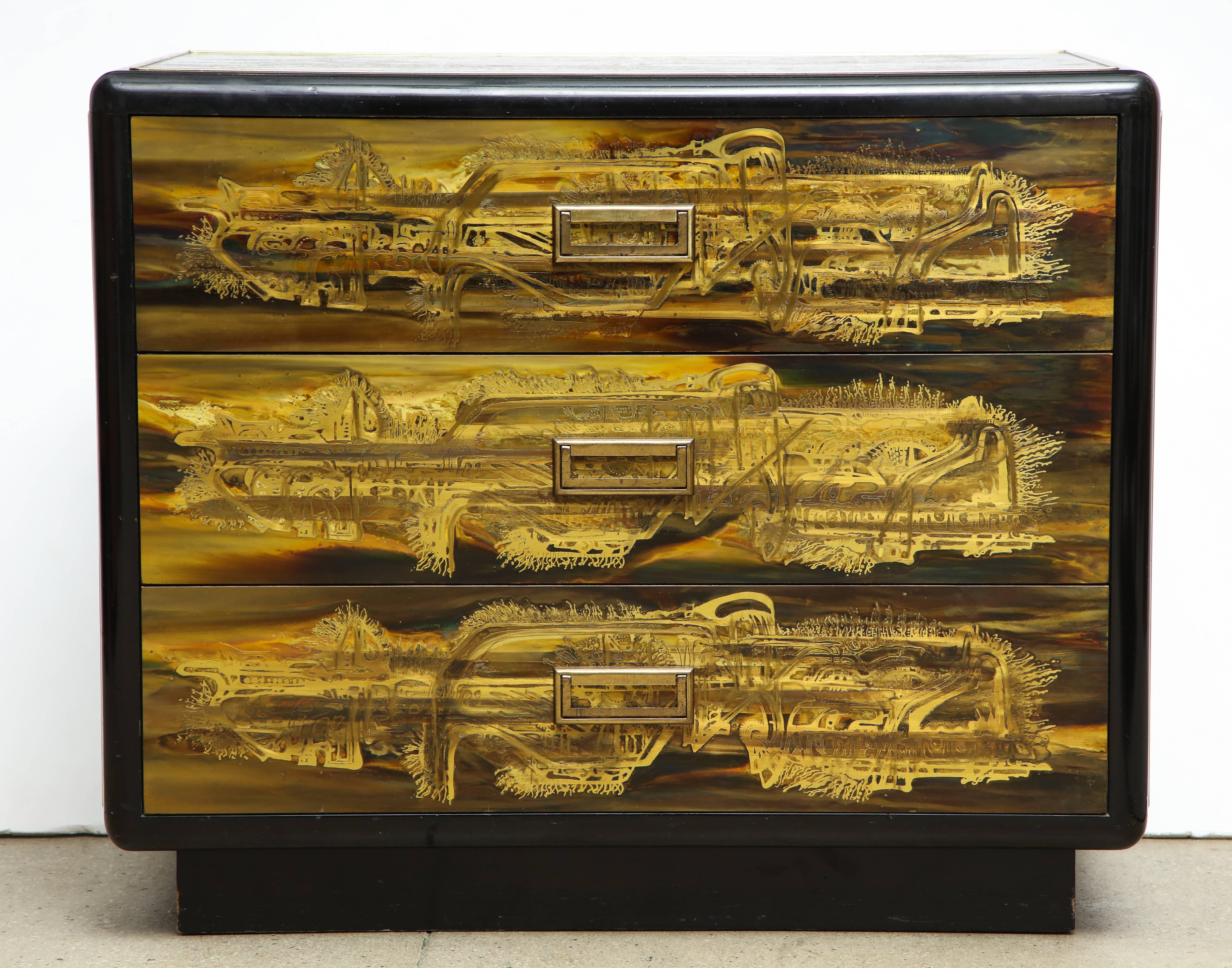 A great three-drawer chest in black lacquer and gold with abstract design for Mastercraft by designer Bernard Rohne.