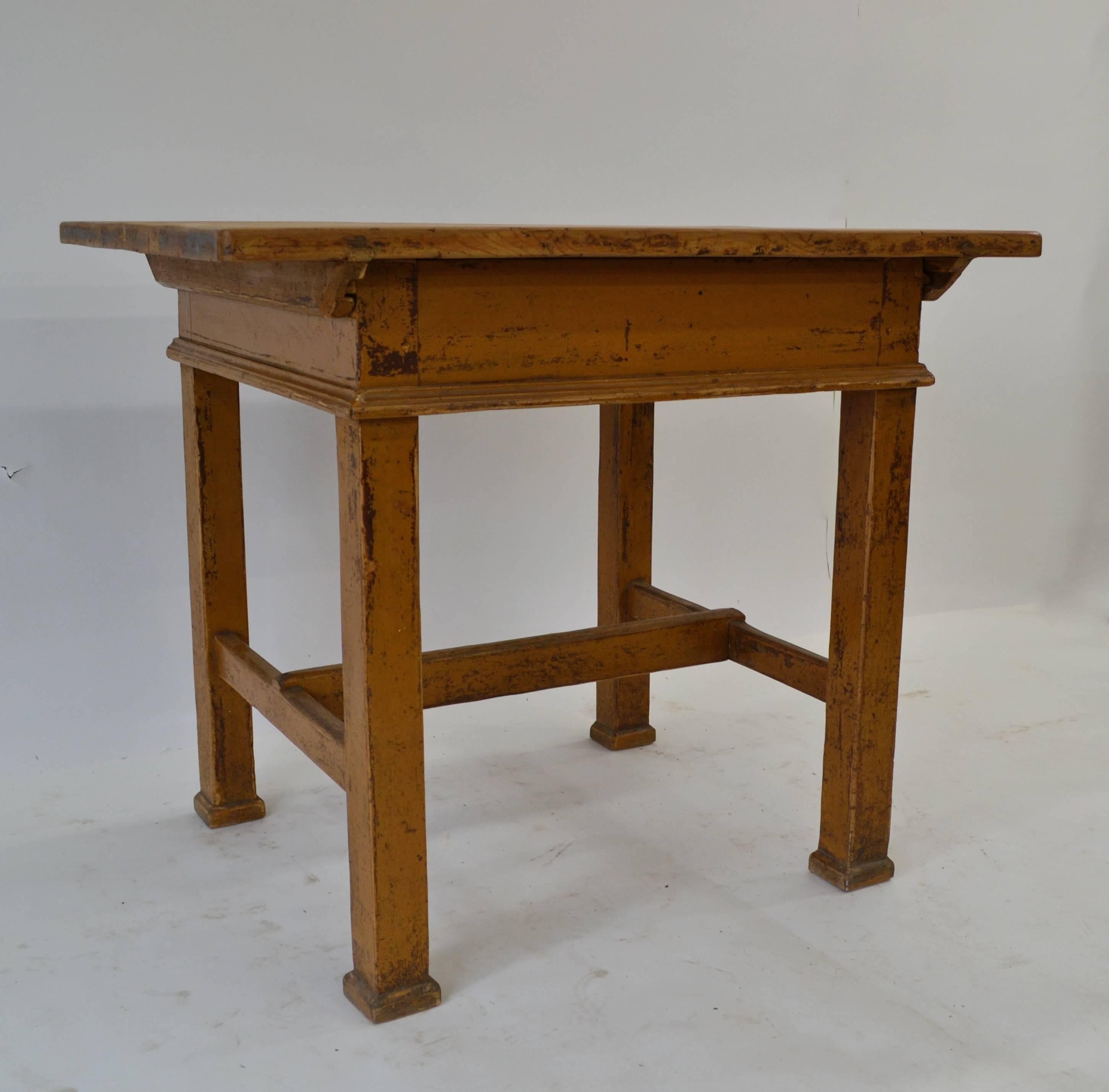 This is another of our charming rustic tables from central Europe. This one has a three board top over an inch thick with wooden cleats dovetailed into its underside. These keep the top nice and flat and allow the boards to expand and contract