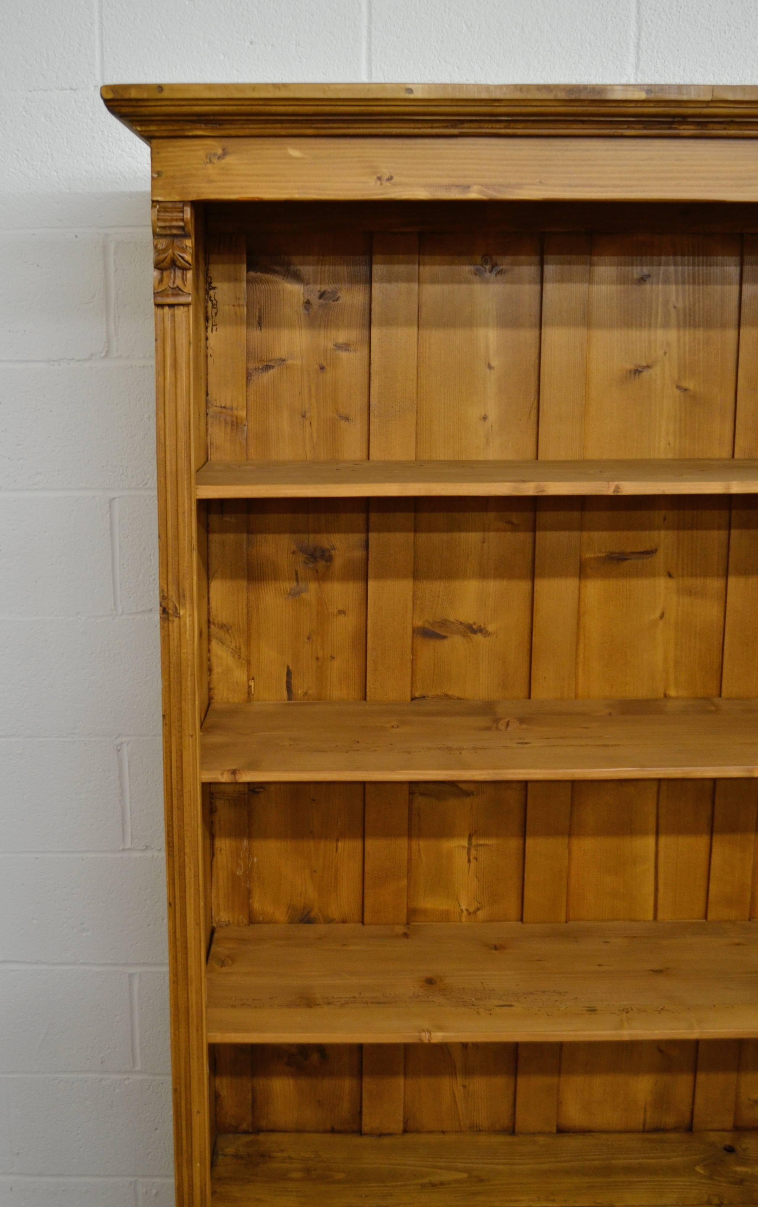 A vintage armoire that lost its doors provided the shell of this bookcase, with one side board removed to reduce the depth and the original drawer cut down to fit. Three strong shelves from reclaimed pine provide four big spaces for storing books or