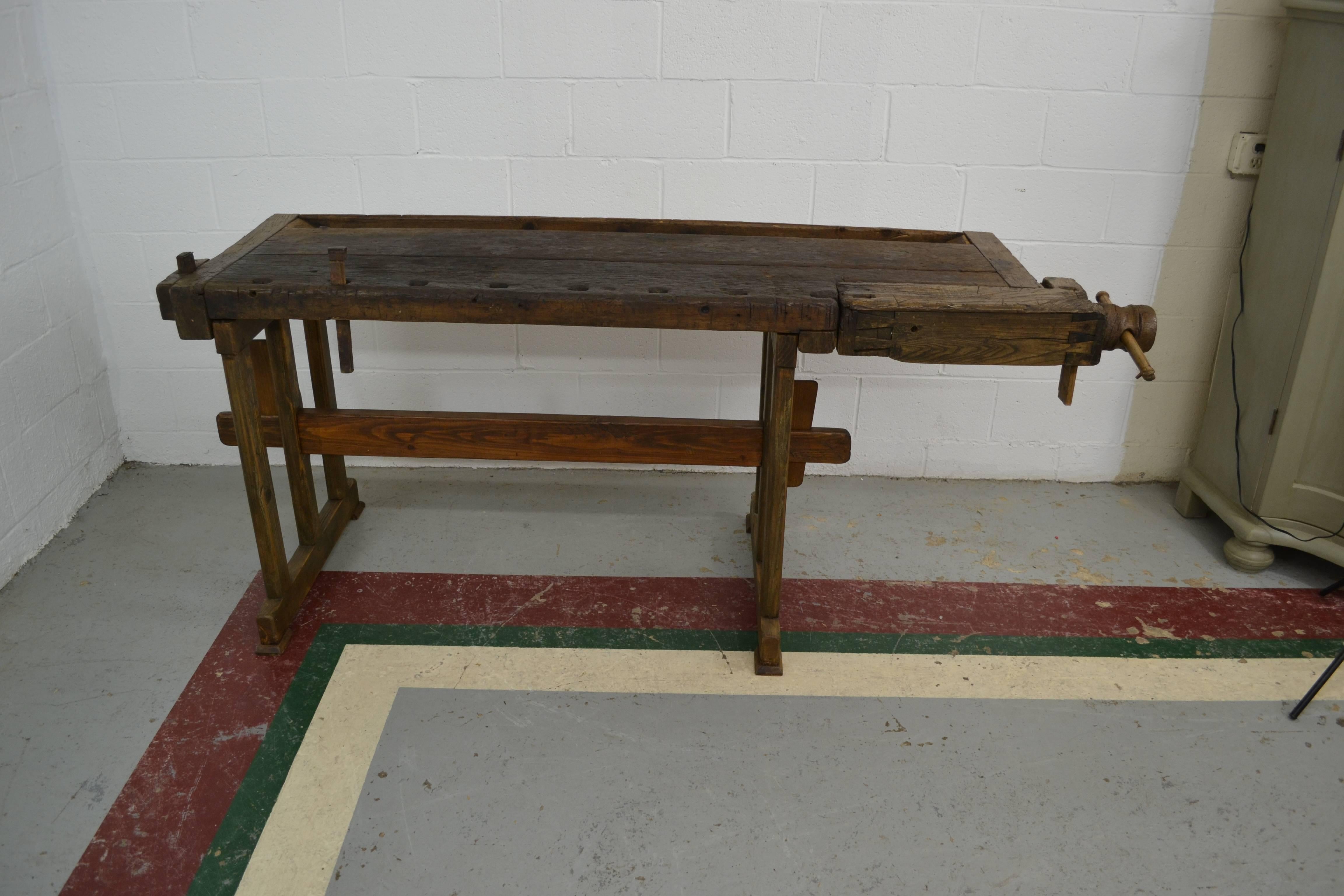 Another one of our outstanding European carpenter’s workbenches, this one is beautifully gnarled after decades of use and is a little more versatile in that it has no vise on the front and is therefore more shallow and easier to use as a sofa table