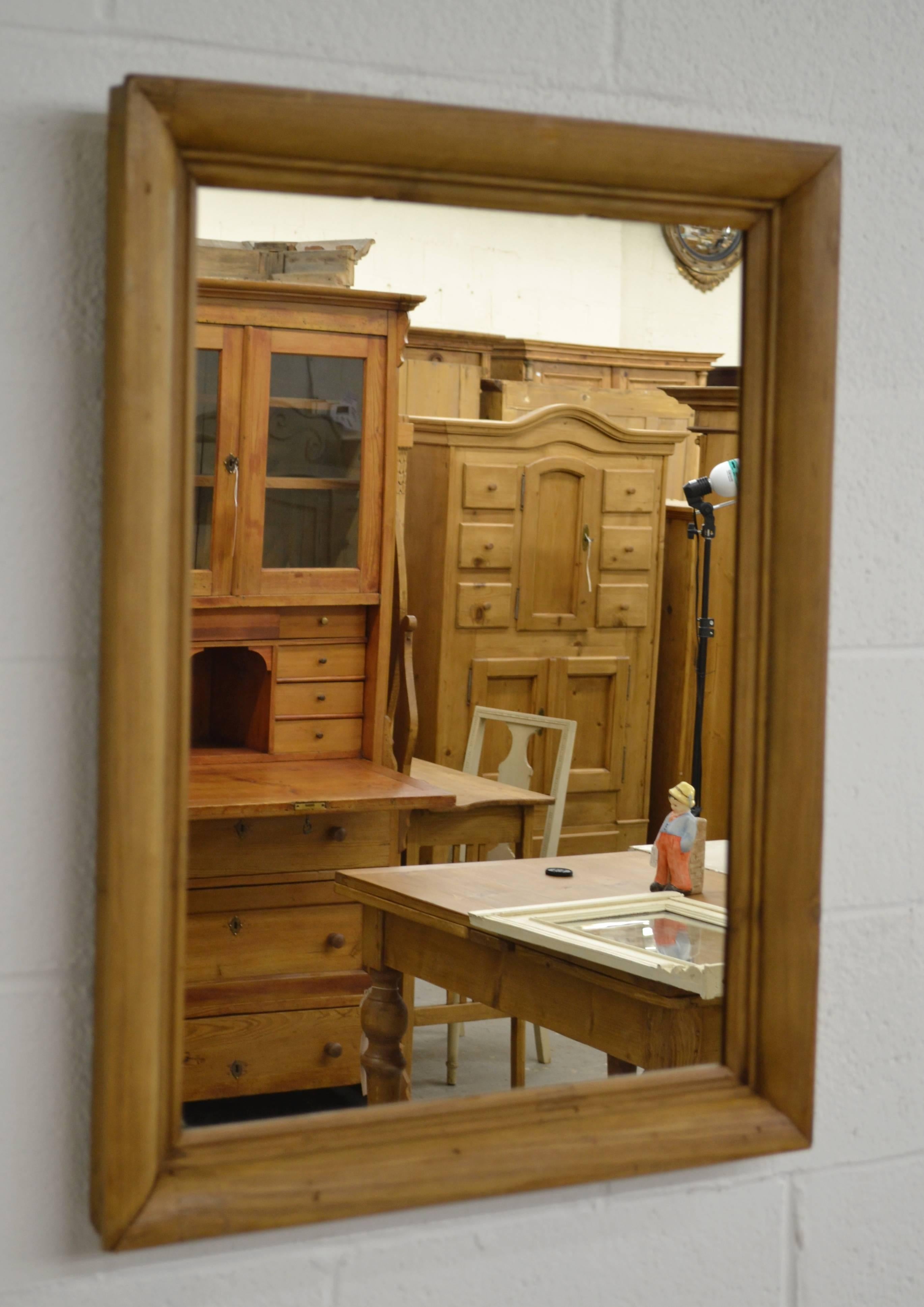 20VJL74j pine framed mirror. Measures: 23” W x 30” H.
 A handsome antique pine frame 2.5” thick and 2” deep, fitted with new mirror glass. $350
 