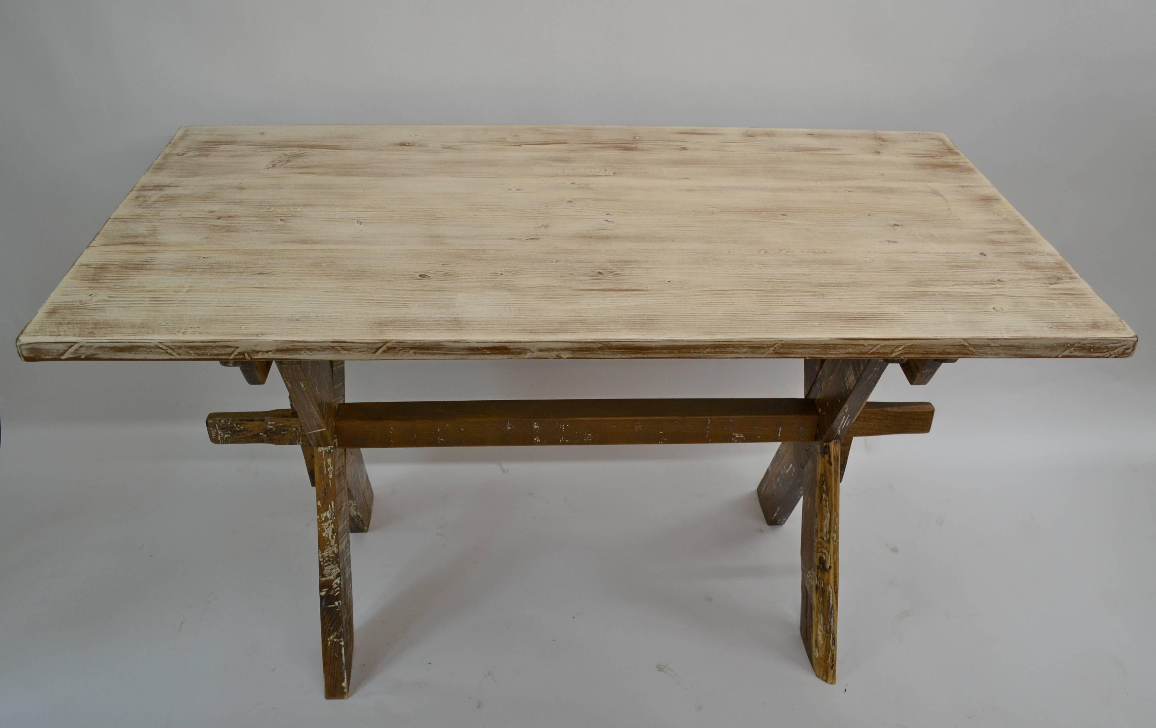 19VJL86a pine and oak trestle table, circa 1860. Measures: 56 x 29.5 x 31. $950.00.
This is an early oak “X” base trestle in very distressed old white paint, showing all the straight cut saw marks that signify manufacture by hand. A sturdy