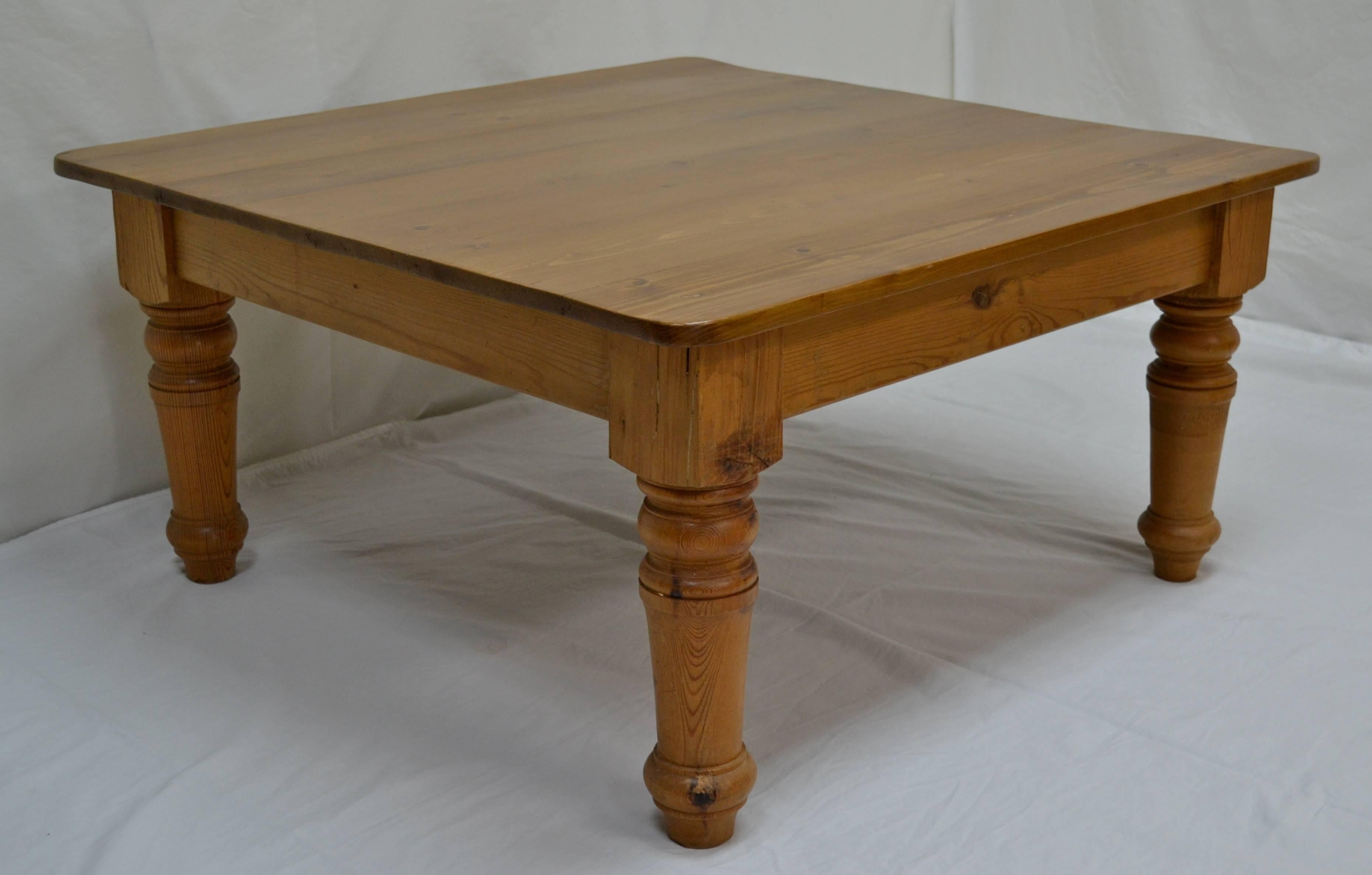 A small square turned leg coffee table constructed from reclaimed pine.  The five board top has a wipe-off lacquer finish.
