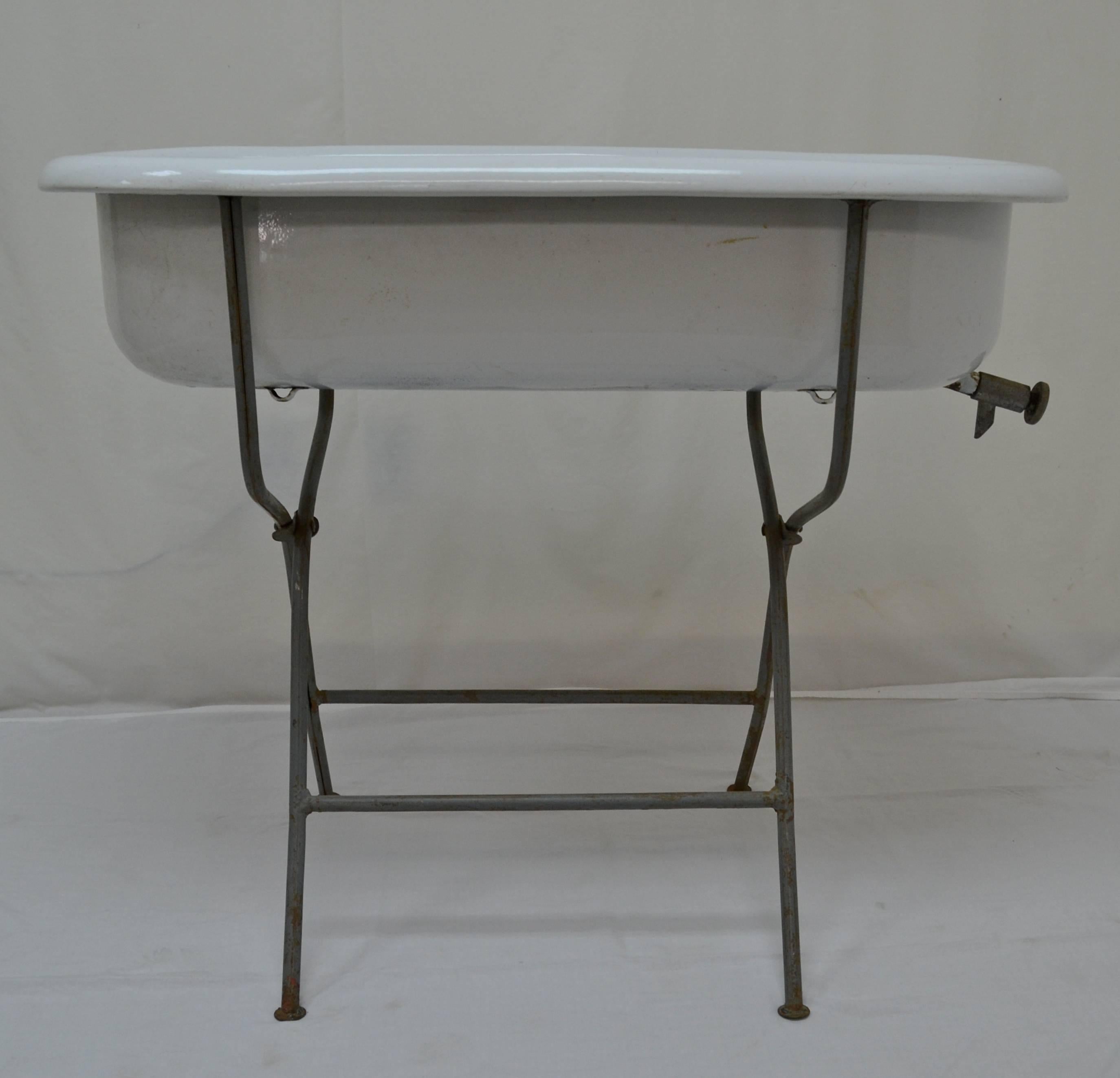 Vintage Porcelain Enameled Baby Bath on Folding Wrought Iron Stand In Excellent Condition In Baltimore, MD