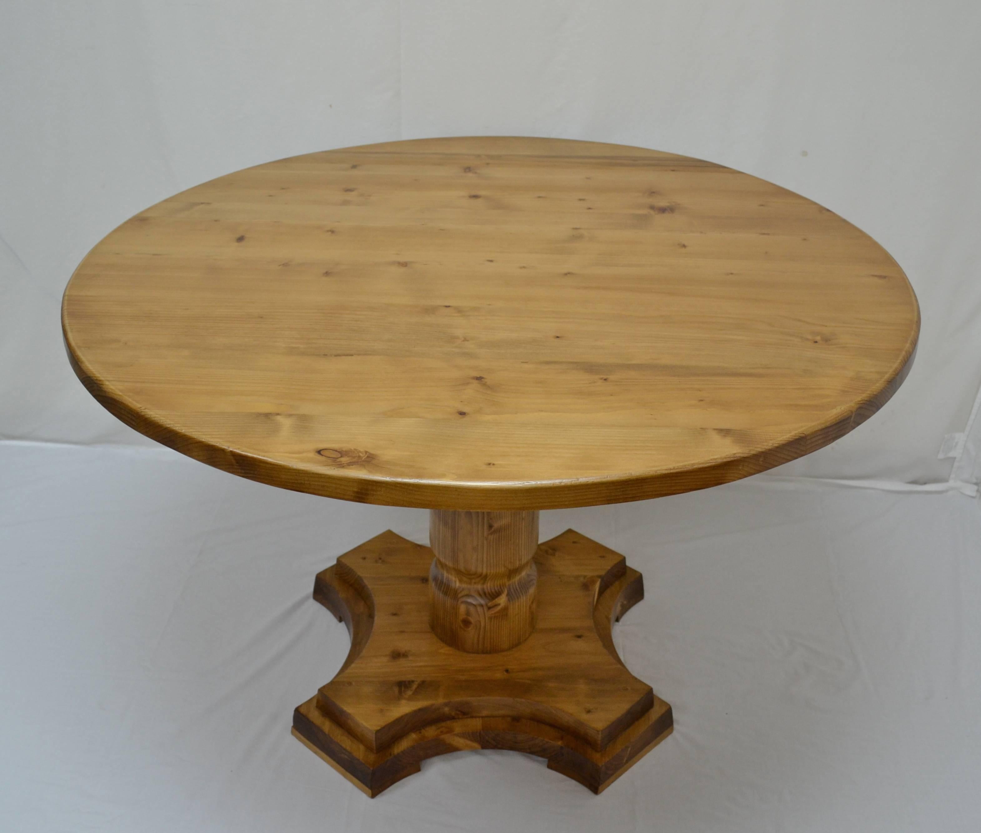 Antique pine pedestal tables are extremely hard to find so our workshop in Europe has taken lightly-used reclaimed pine to fashion this plain and simple reproduction. The 1.25” thick top with a softened edge is mounted on a slightly tapering waisted