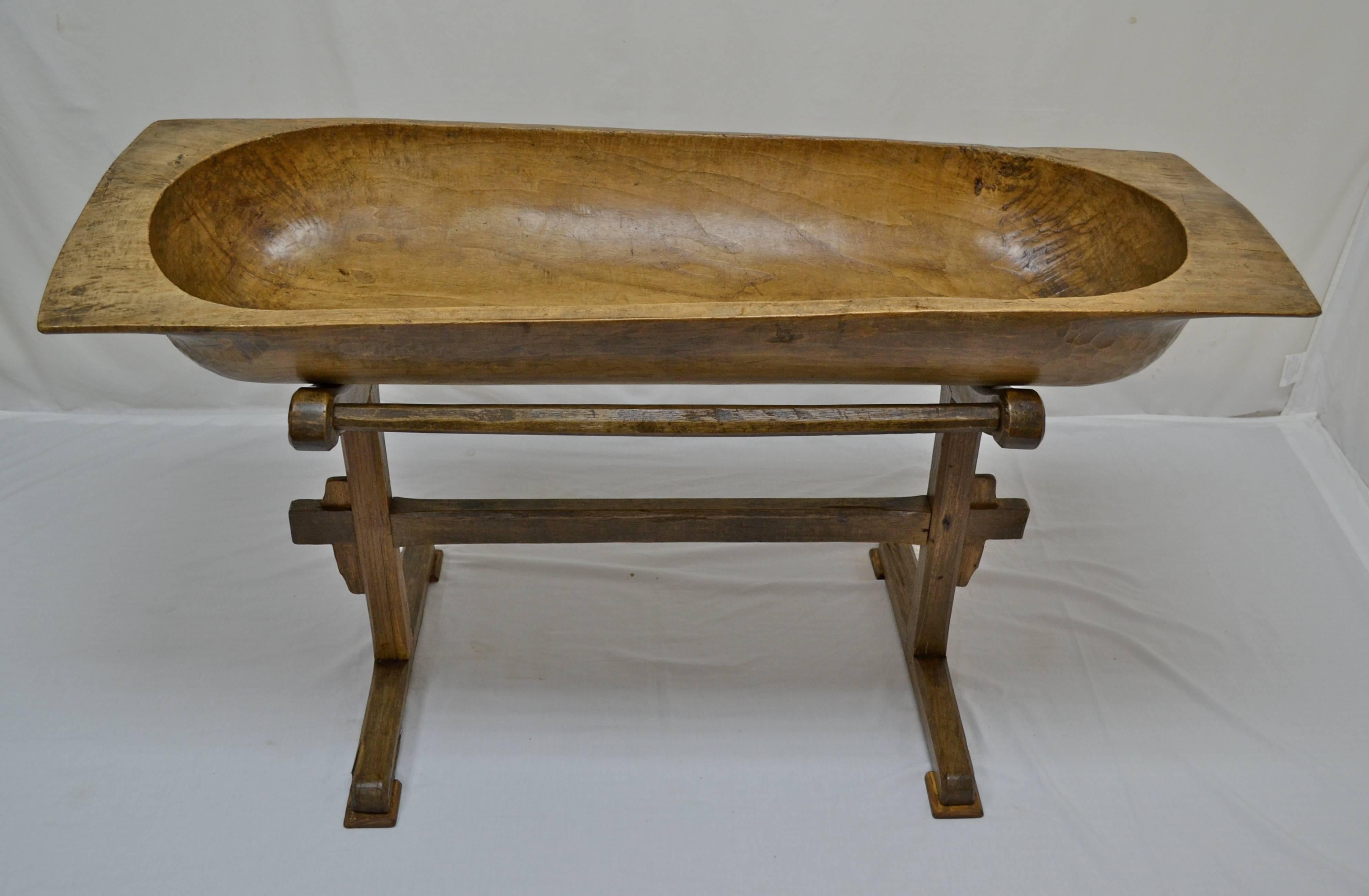 Used for multi-family baking, this enormous fruitwood trog was handcrafted from a single split log. It has developed something of a “twist” over the years but still sits firmly, cradled in the arches of the base. The trog has one or two minor cracks