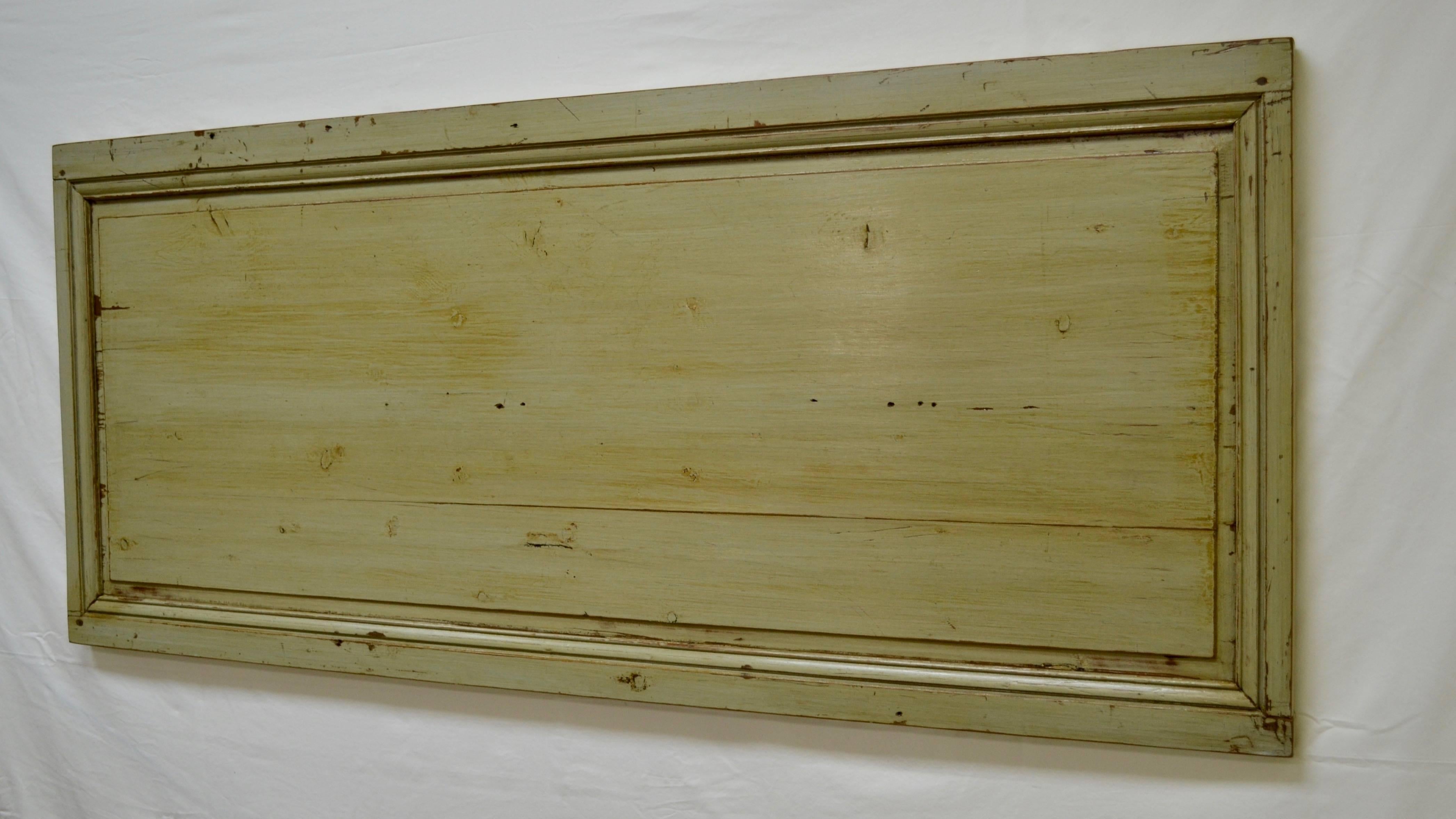 An old pine paneled room in France has yielded this beautifully-made framed raised panel, which we think looks great as a rustic queen-size headboard, mounted on the wall above the bed. This panel is 67.5” wide, allowing just a little overhang to