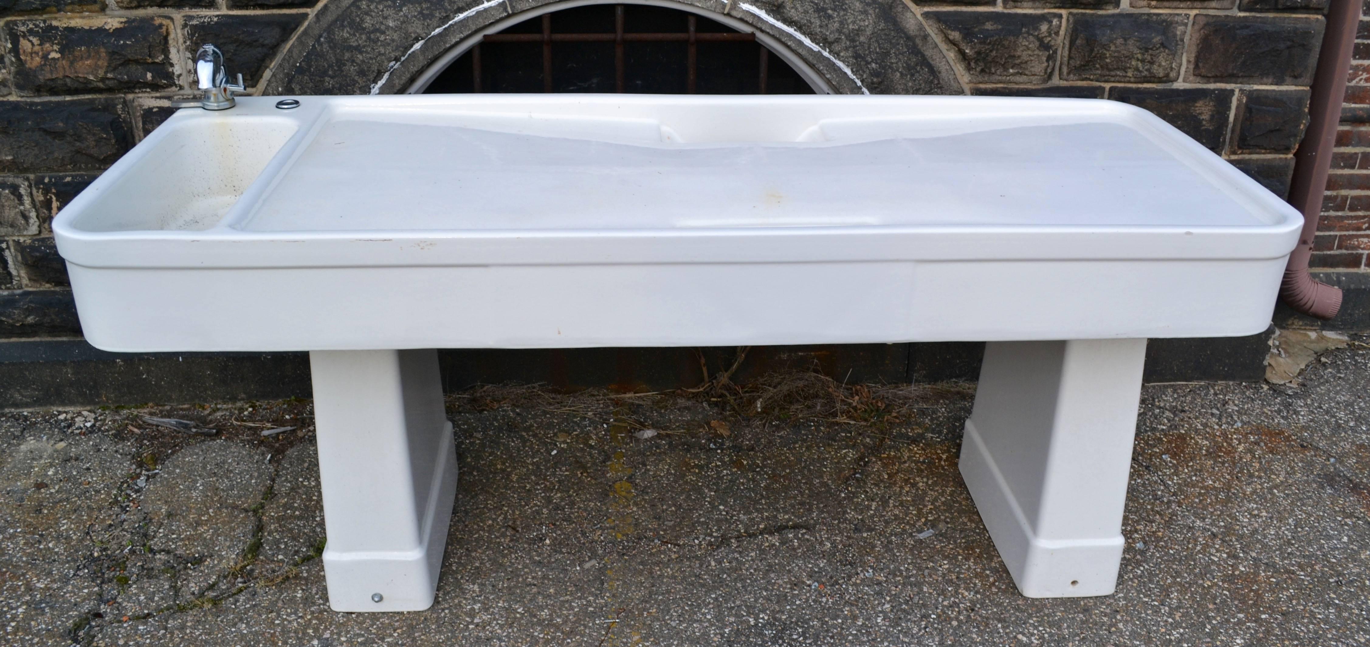 A three-piece autopsy table with integral sink manufactured by The Crane Plumbing Co. in Canada and salvaged from Baltimore City Hospital Morgue.