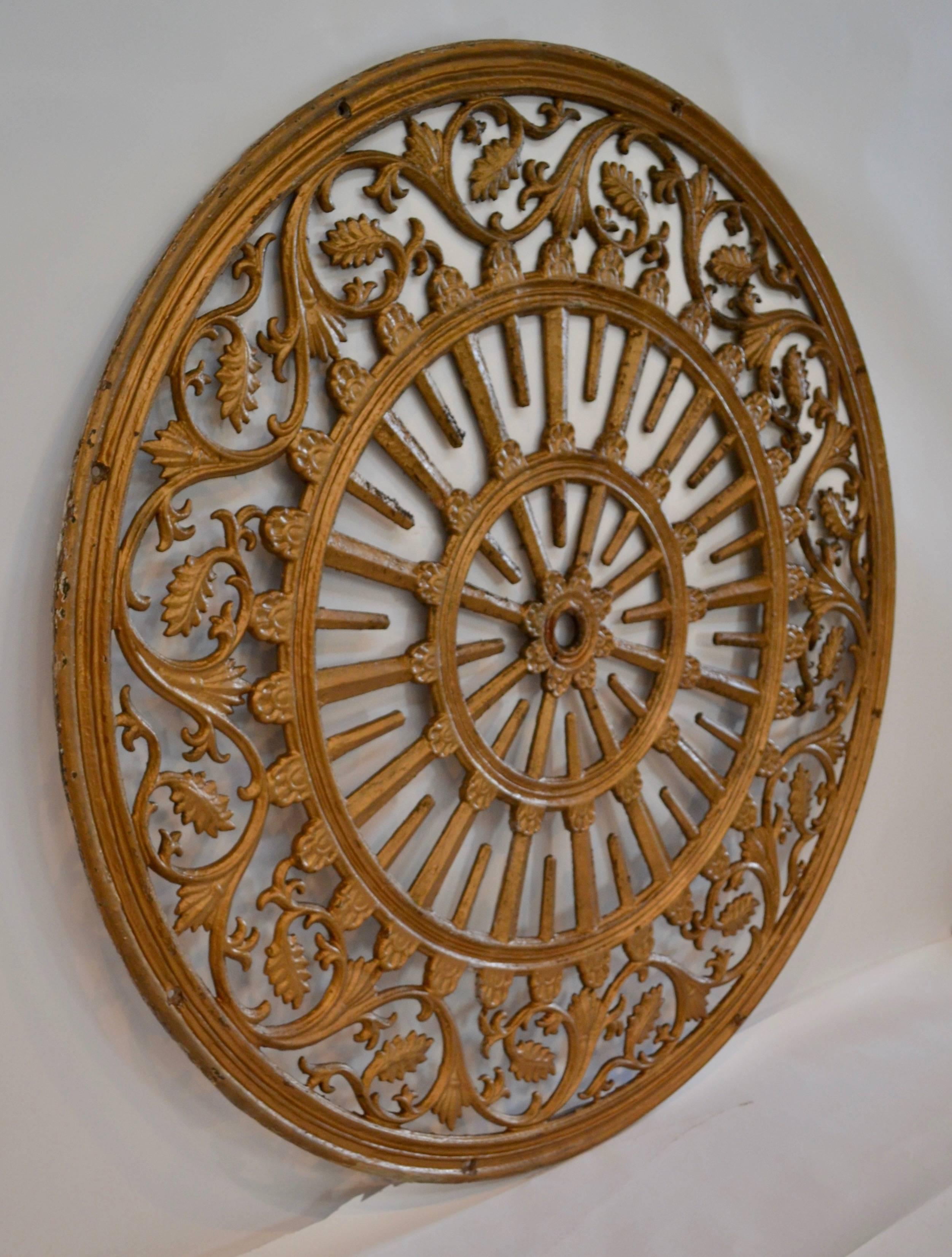 A massive ceiling medallion in gold paint over cast iron which graced the central nave ceiling of a Baltimore church renovated by the celebrated Baltimore architect George Lino (Peabody Institure) in 1870.  Rarely found in this material and size, it