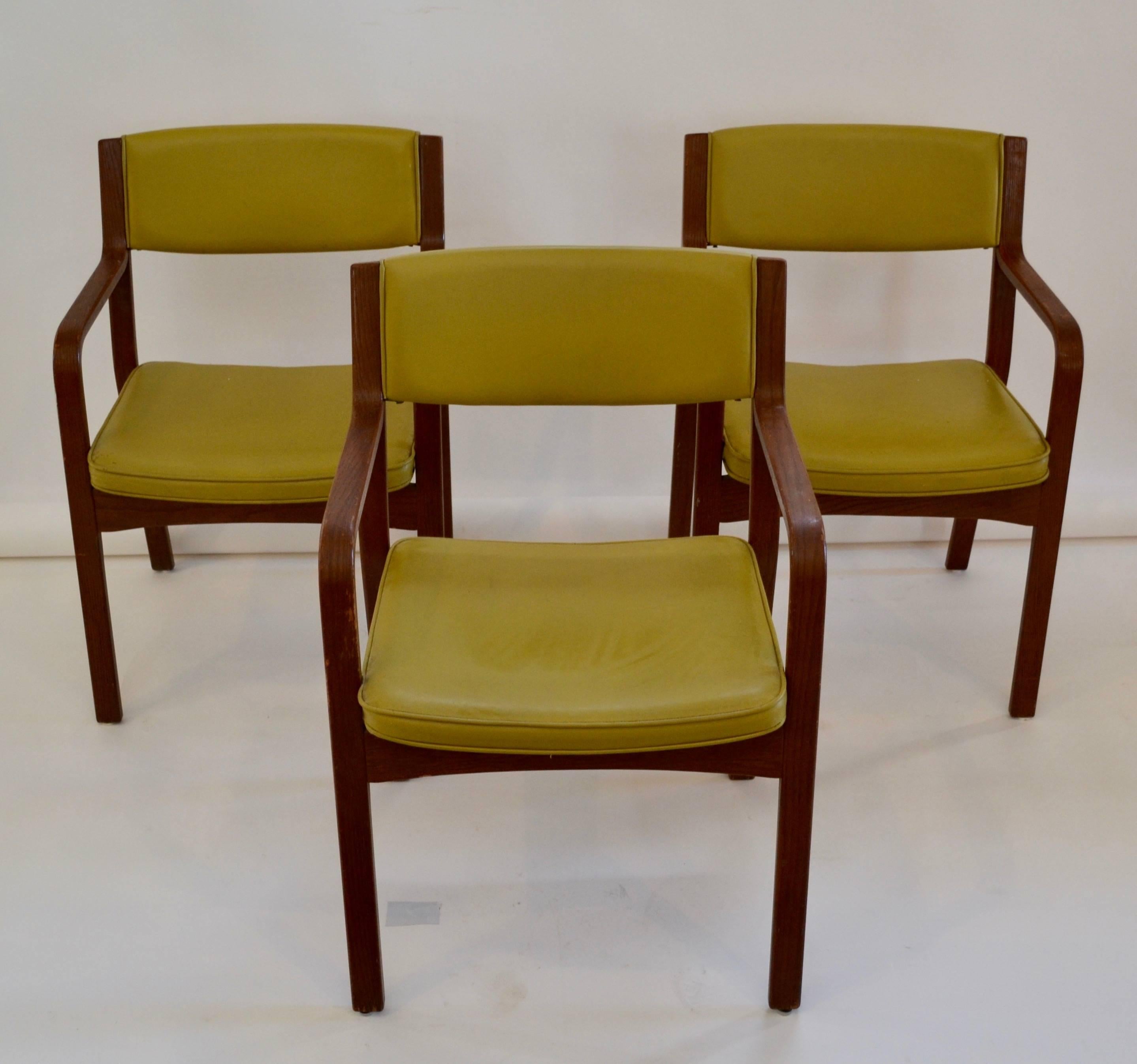 Set of four vinyl and bentwood Thonet armchairs with original finish and green upholstery. These chairs are characteristically sturdy, comfortable and well proportioned. They are in remarkably clean condition.