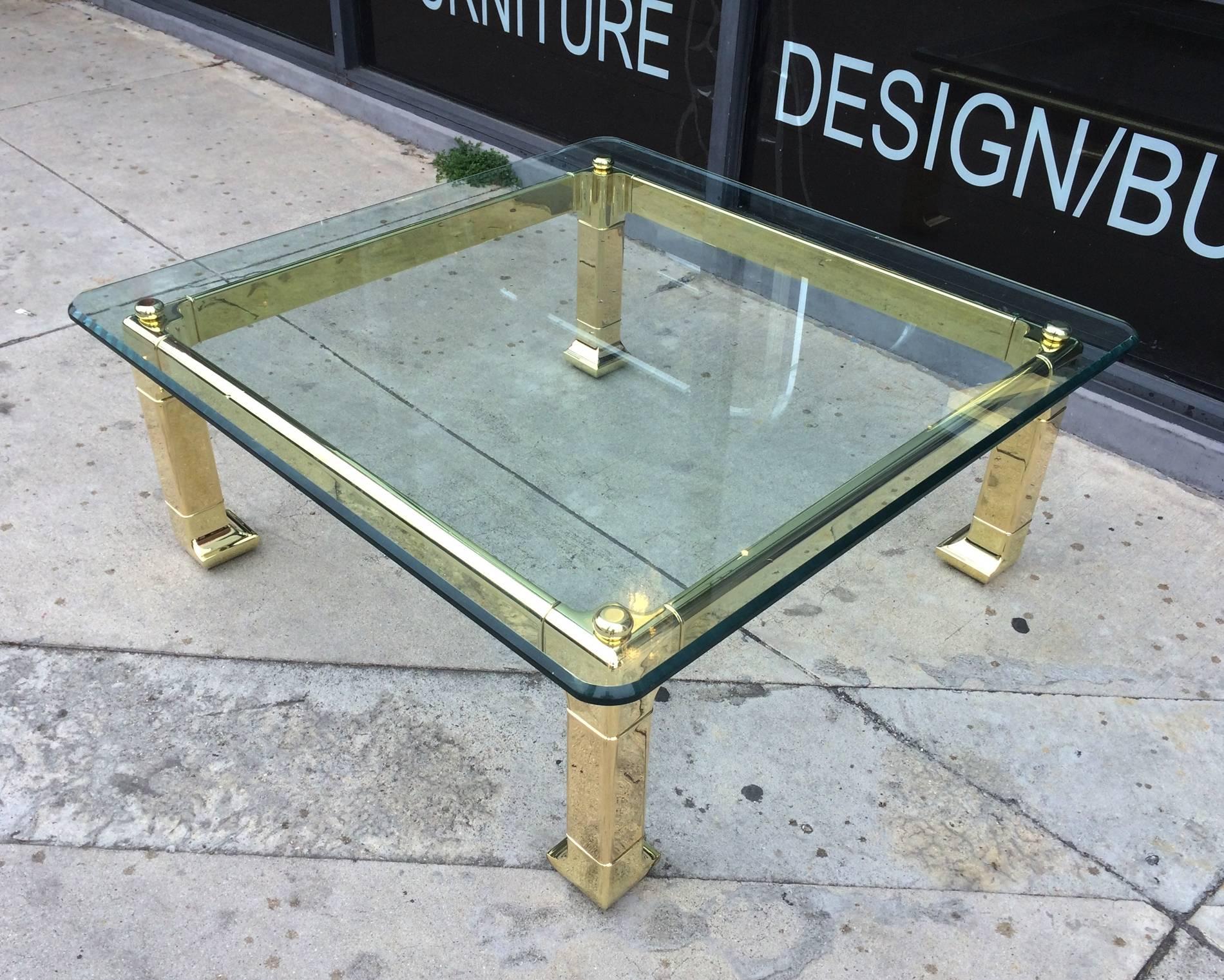 Stunning and rare solid brass coffee table designed and manufactured in the 1970s by Mastercraft.
The table is newly polished and is in excellent condition, the glass is original and it has a nice bevel edge however a few surface scratches are
