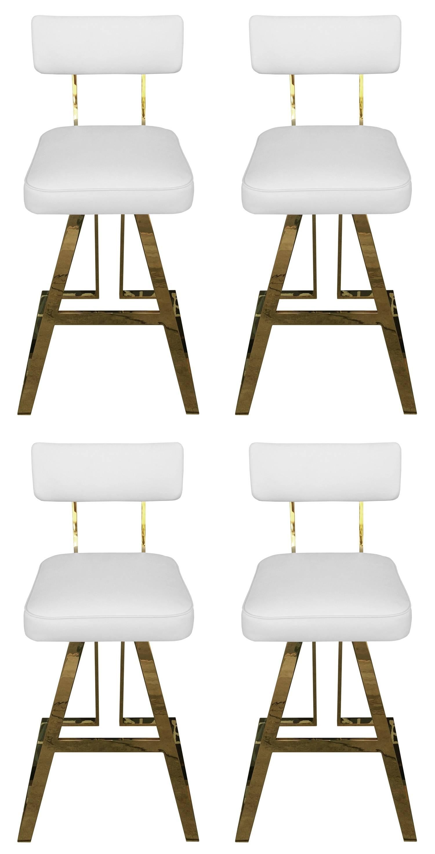 Stunning and rare sate of four bar-stools designed by Charles Hollis Jones in the 1960s.

The bars-stools are executed in brass and they have beautiful architectural lines, the seats swivel 360 degrees and they are very comfortable.

The stools