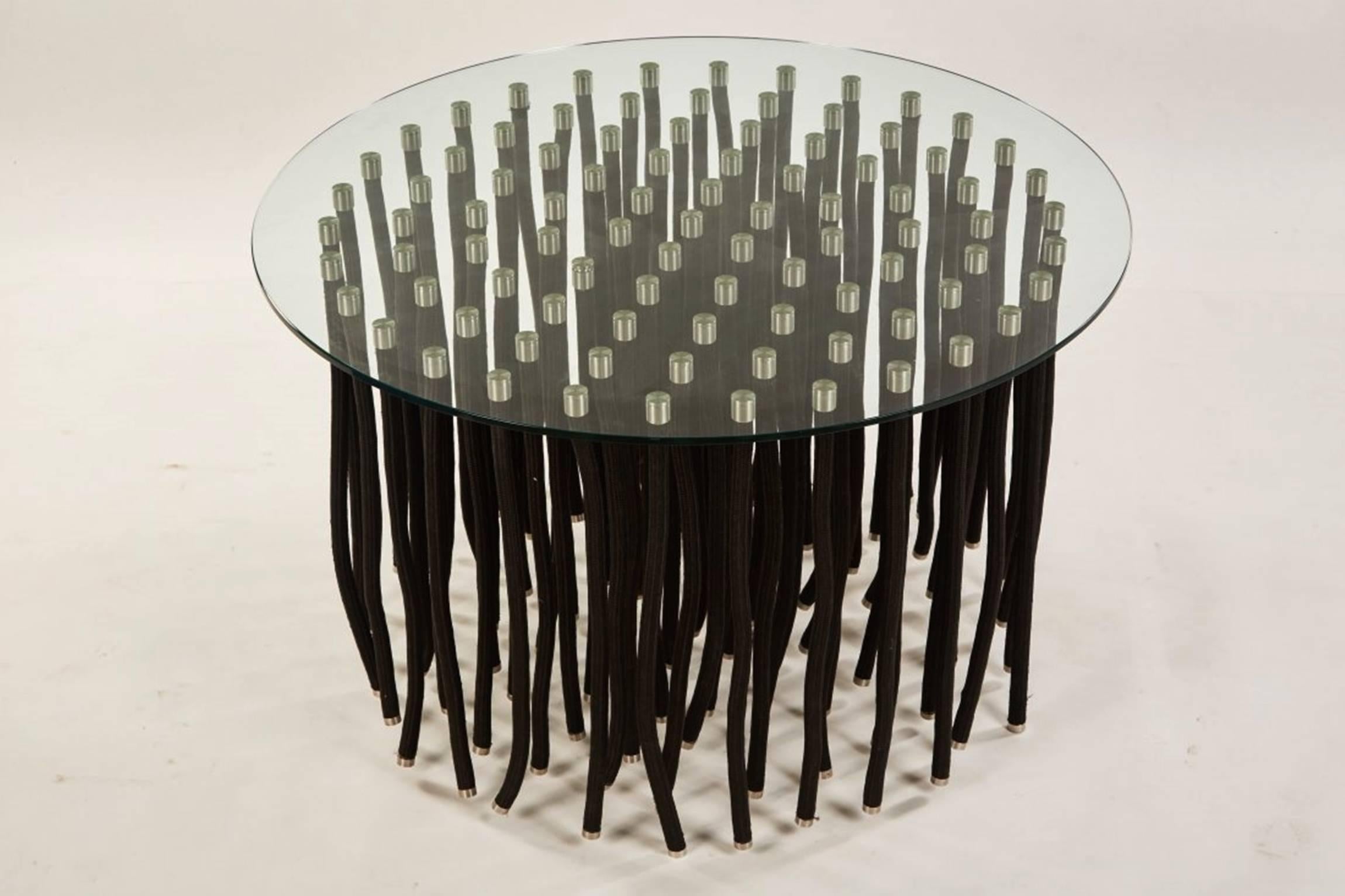 Stunning and beautiful ORG dining or center table designed by Fabio Novembre and manufactured by Capellini in Milano Italy in 2001.
The table is made out of flexible polypropylene with internal steel and satin stainless steel caps both on the top