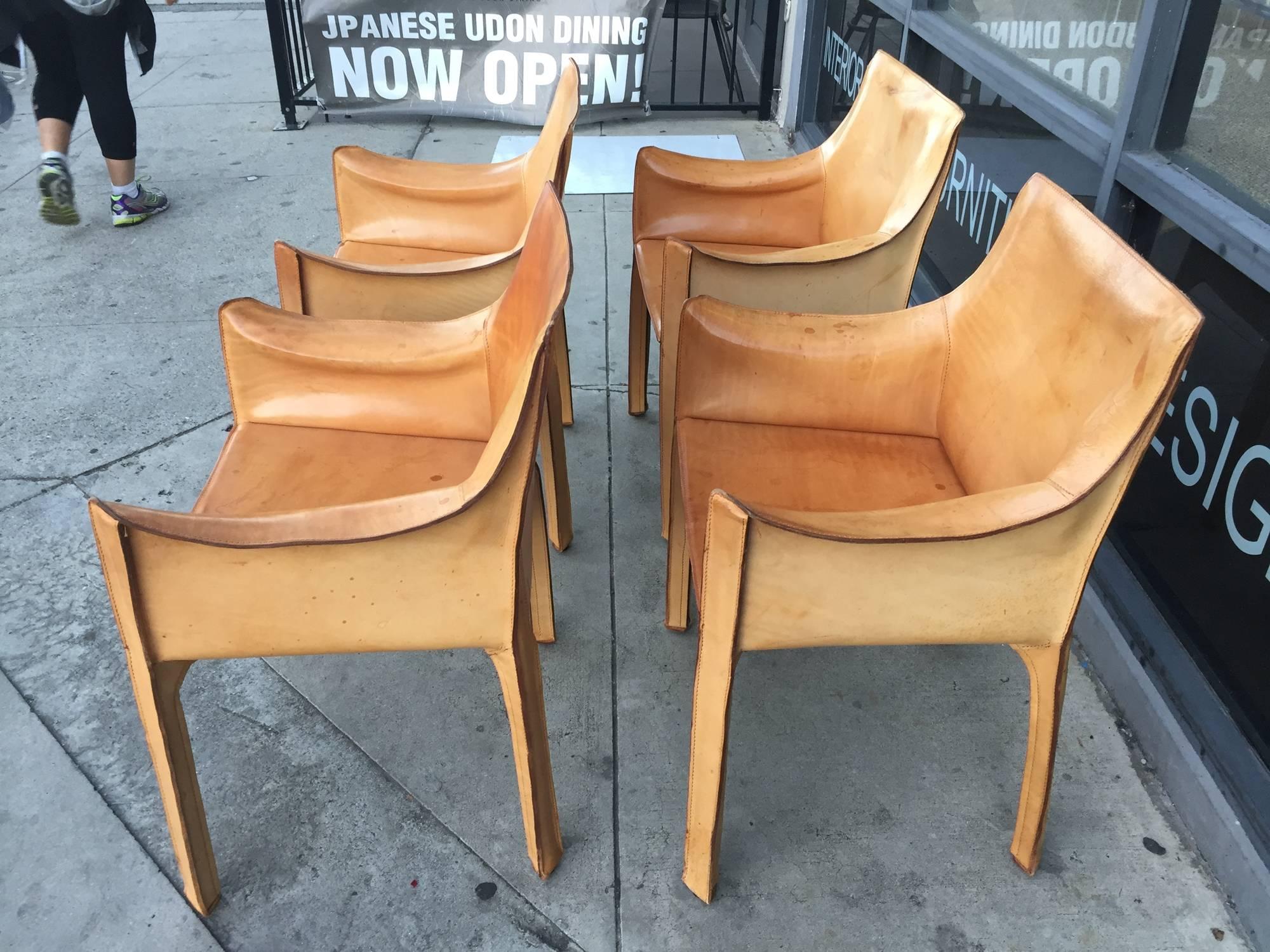 Parchment table not included but available for sale.
Cab chairs designed by Mario Bellini for Cassina Italy in the desirable and rare natural saddle leather. Great original vintage condition. Signed with molded manufacturer's mark and stamped in