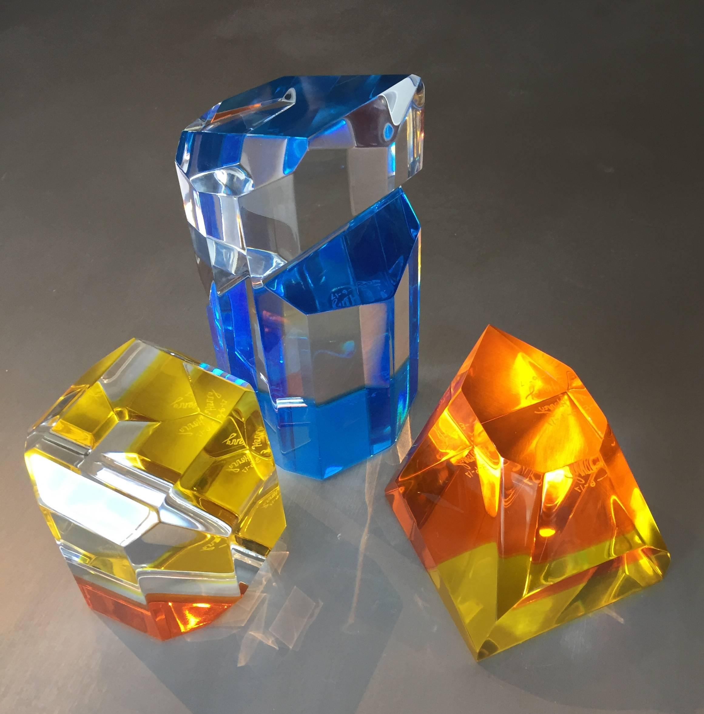 Fantastic trio of Lucite sculptures with geometric shapes designed and manufactured by a Los Angeles artist and signed 