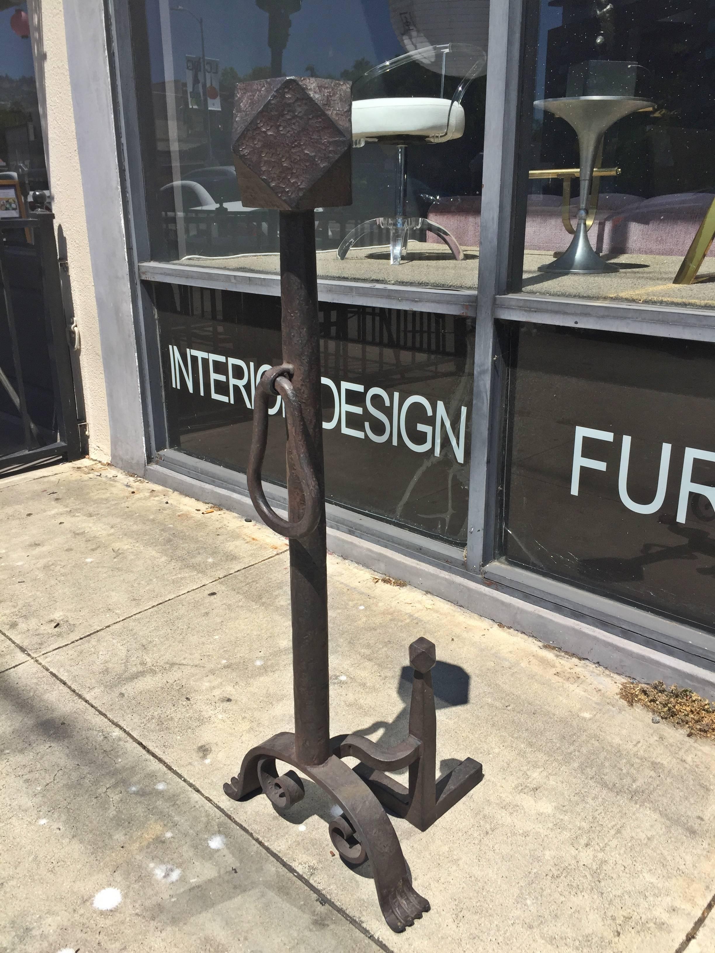Pair of tall set of andirons designed and manufactured in Los Angeles by Paul Ferrante.

The pieces are made of Iron with an old iron patina finish.

Measurements:
42.50 inches high x 16 inches wide x 13 inches deep.