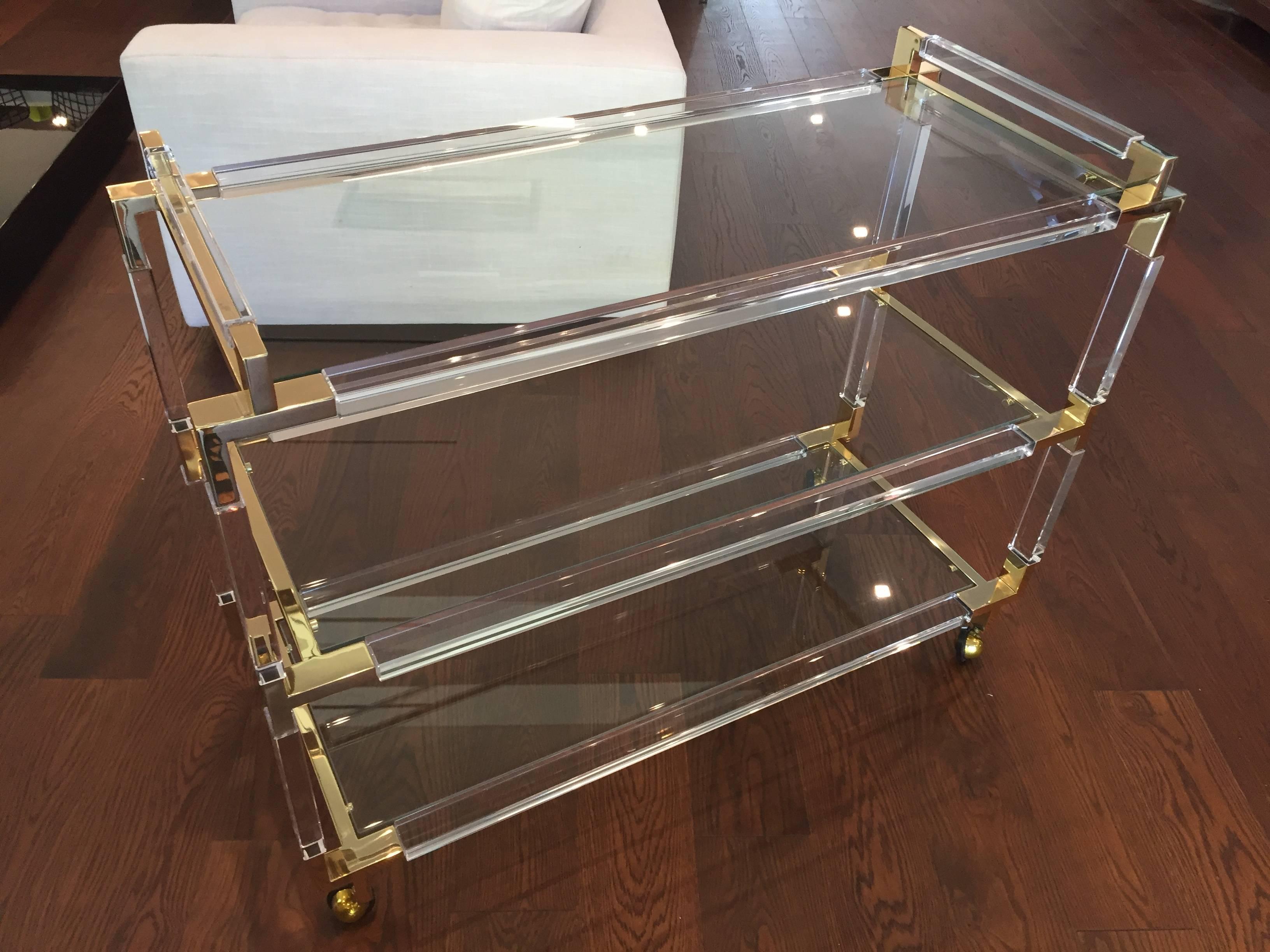 Stunning and beautiful Lucite and brass bar-cart designed and manufactured by Charles Hollis Jones as part of his 