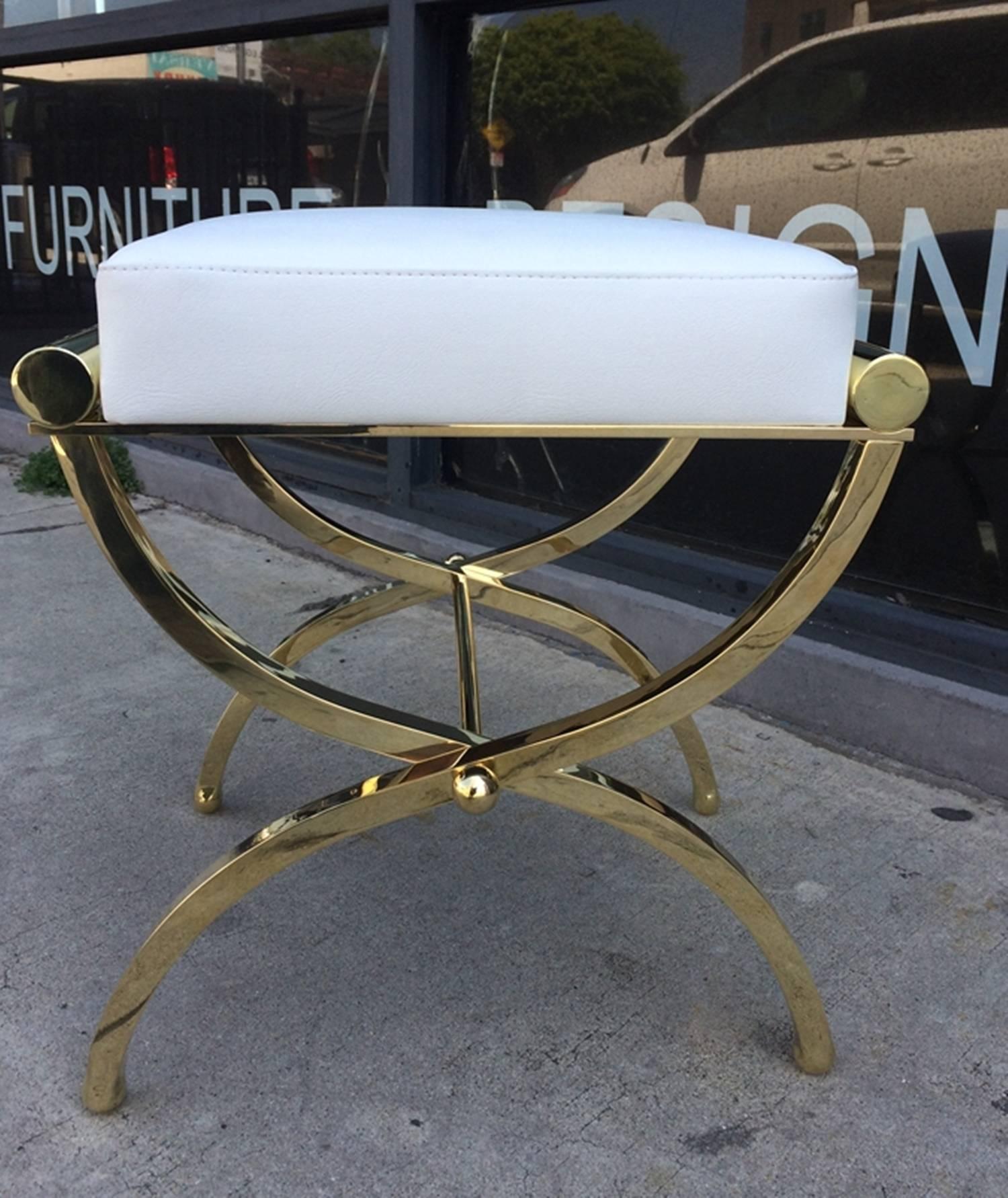 Exceptional pair of Empire style benches designed and manufactured by Charles Hollis Jones.
The benches were designed in the 1960s and they are just as influential today.

The playful frames of these benches is made of solid brass with Lucite