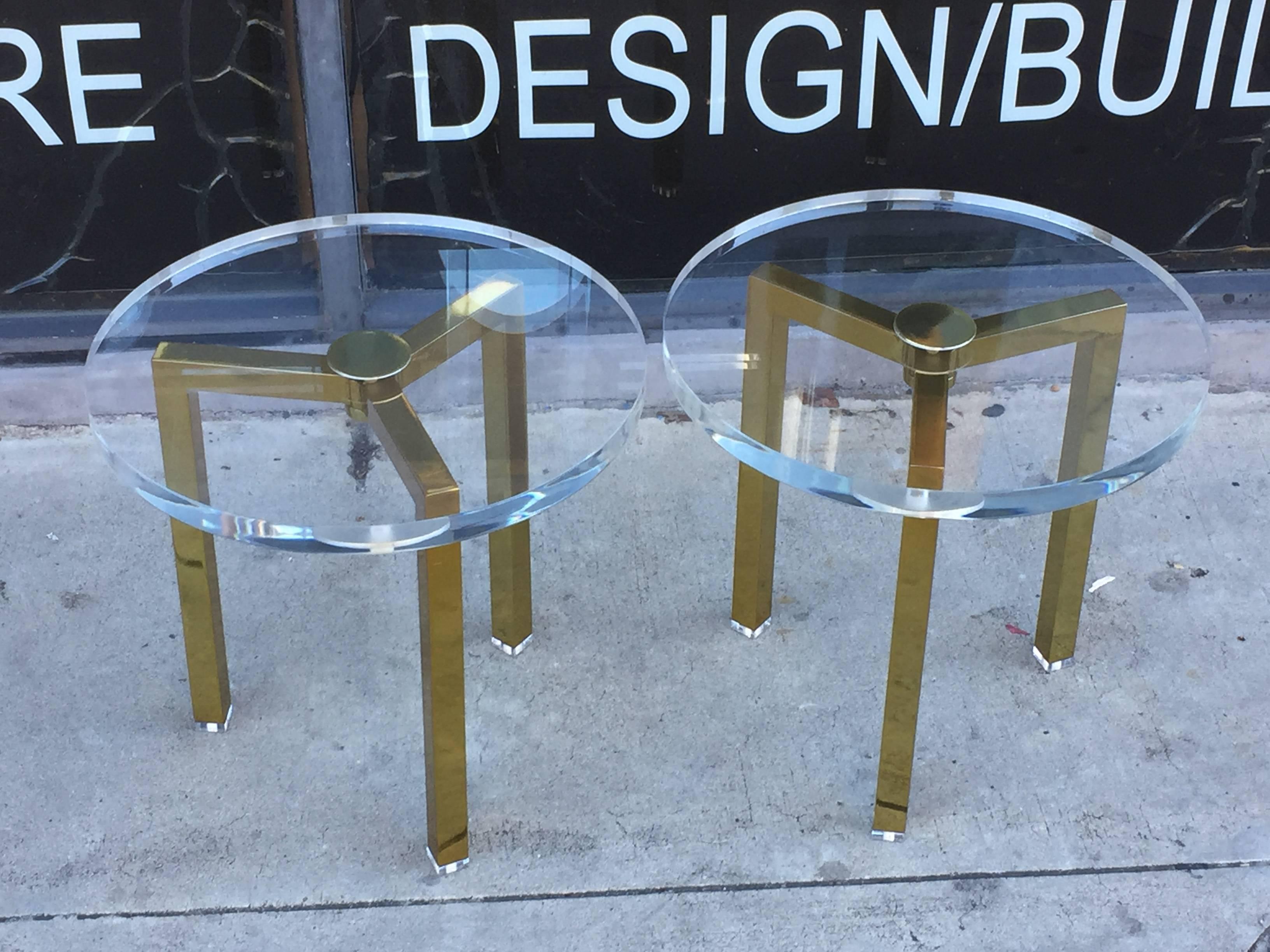 Beautiful pair of brass and Lucite side tables designed by Charles Hollis Jones for Arthur Elrod.
The tables are made of solid steel and brass plated with a 1 1/2