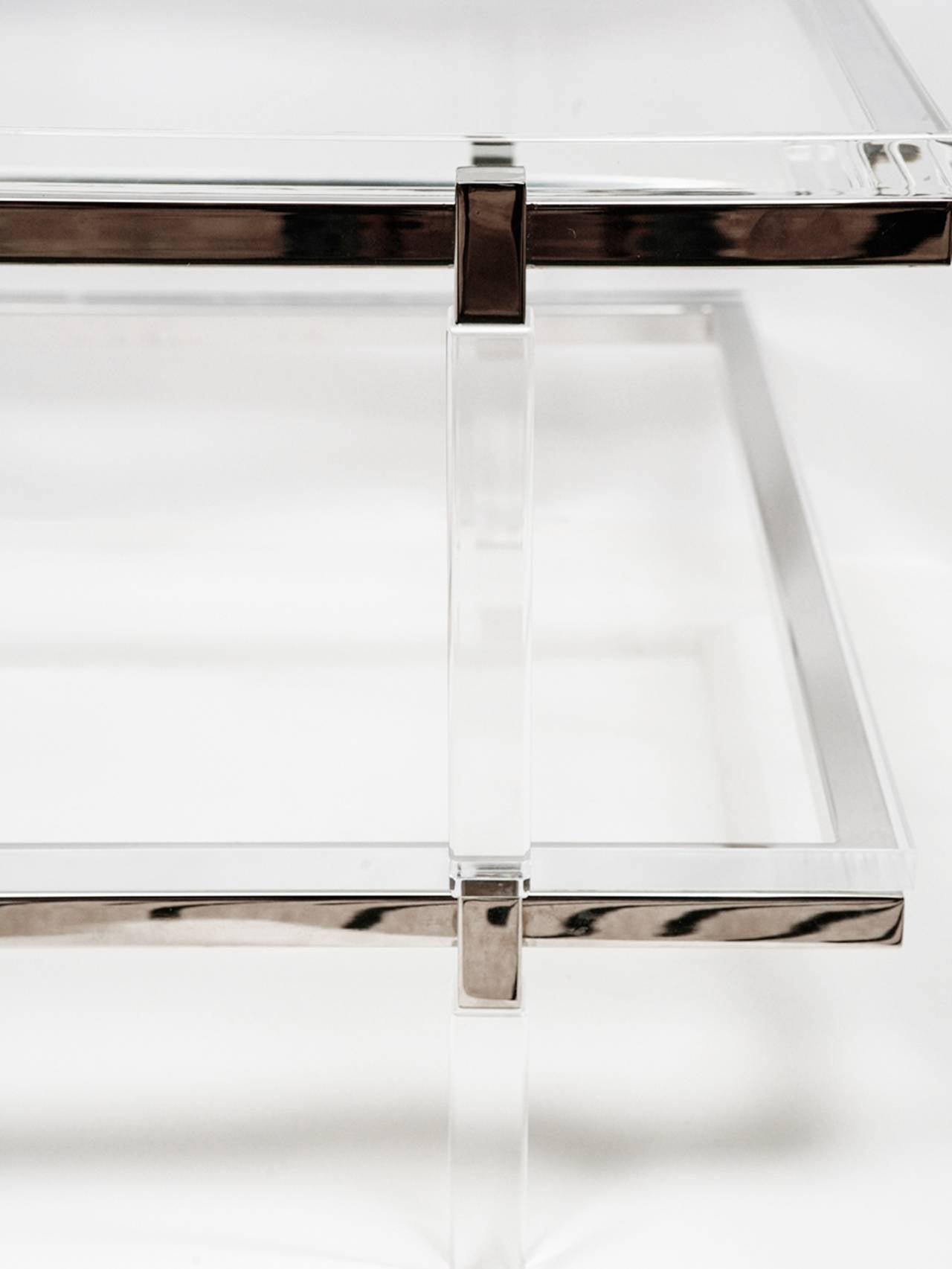 Two-level coffee or cocktail table designed and manufactured by the Icon of Lucite Charles Hollis Jones as part of the Metric collection designed in the 1960s.

The table is executed in Lucite and nickel topped with a 1