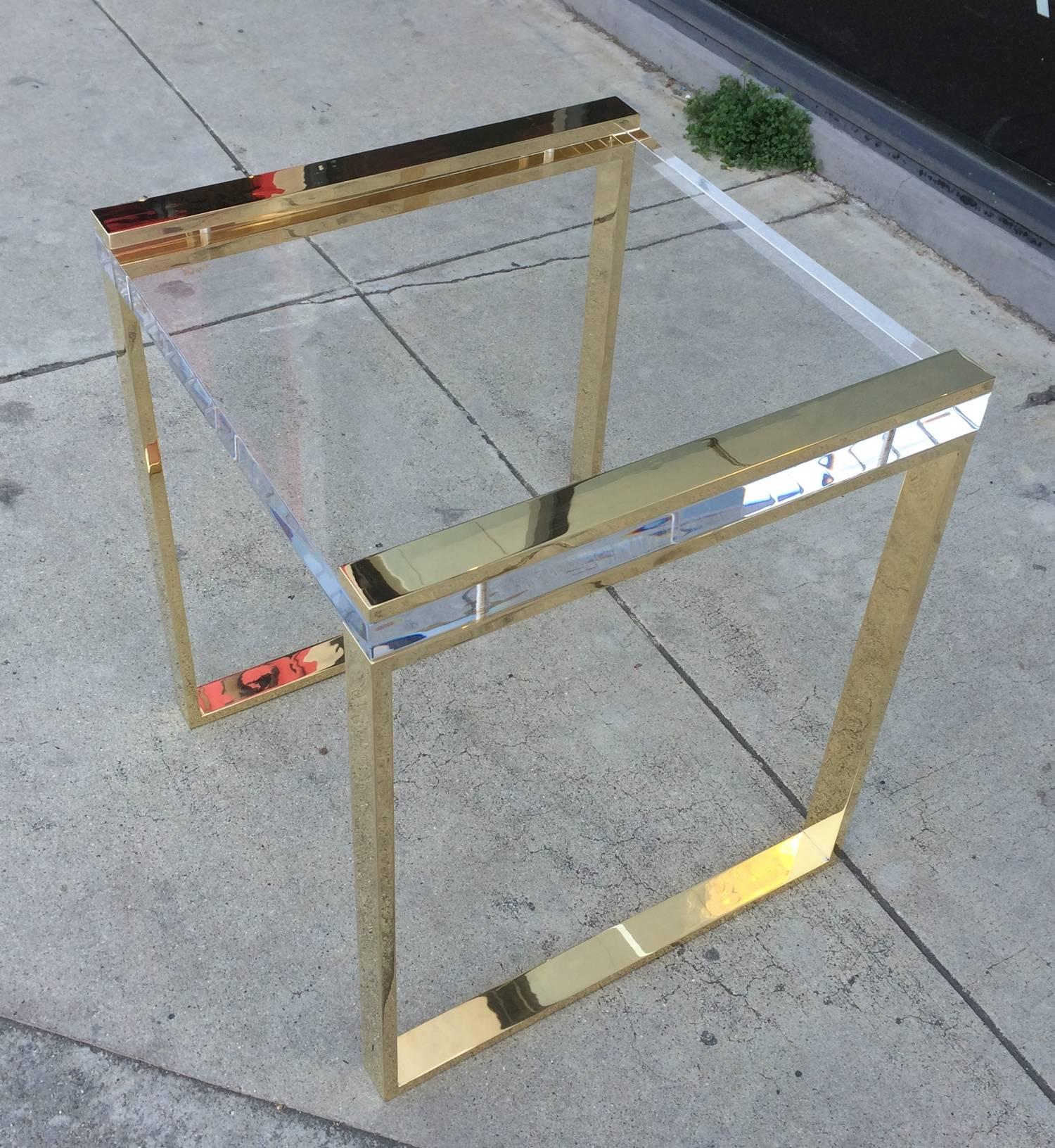 Stunning pair of Lucite and solid brass side or end tables designed and manufactured by Charles Hollis Jones as part of his 