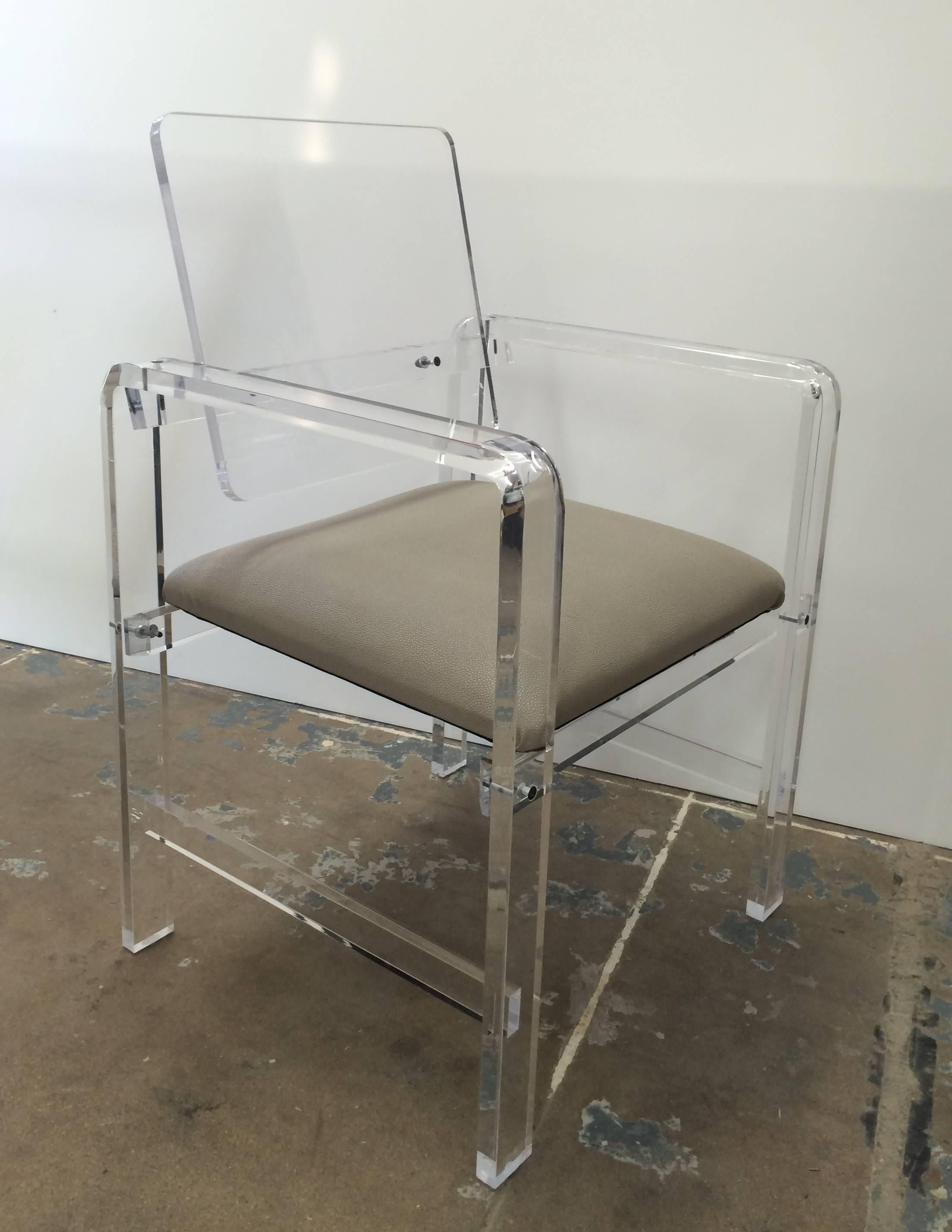 Beautiful and modern Lucite armchairs made to order and upholstered in COM or COL at no additional charge.
These chairs are newly manufactured by Cain Modern and the can be customized and made in clear or smoked Lucite.

The chairs are very well