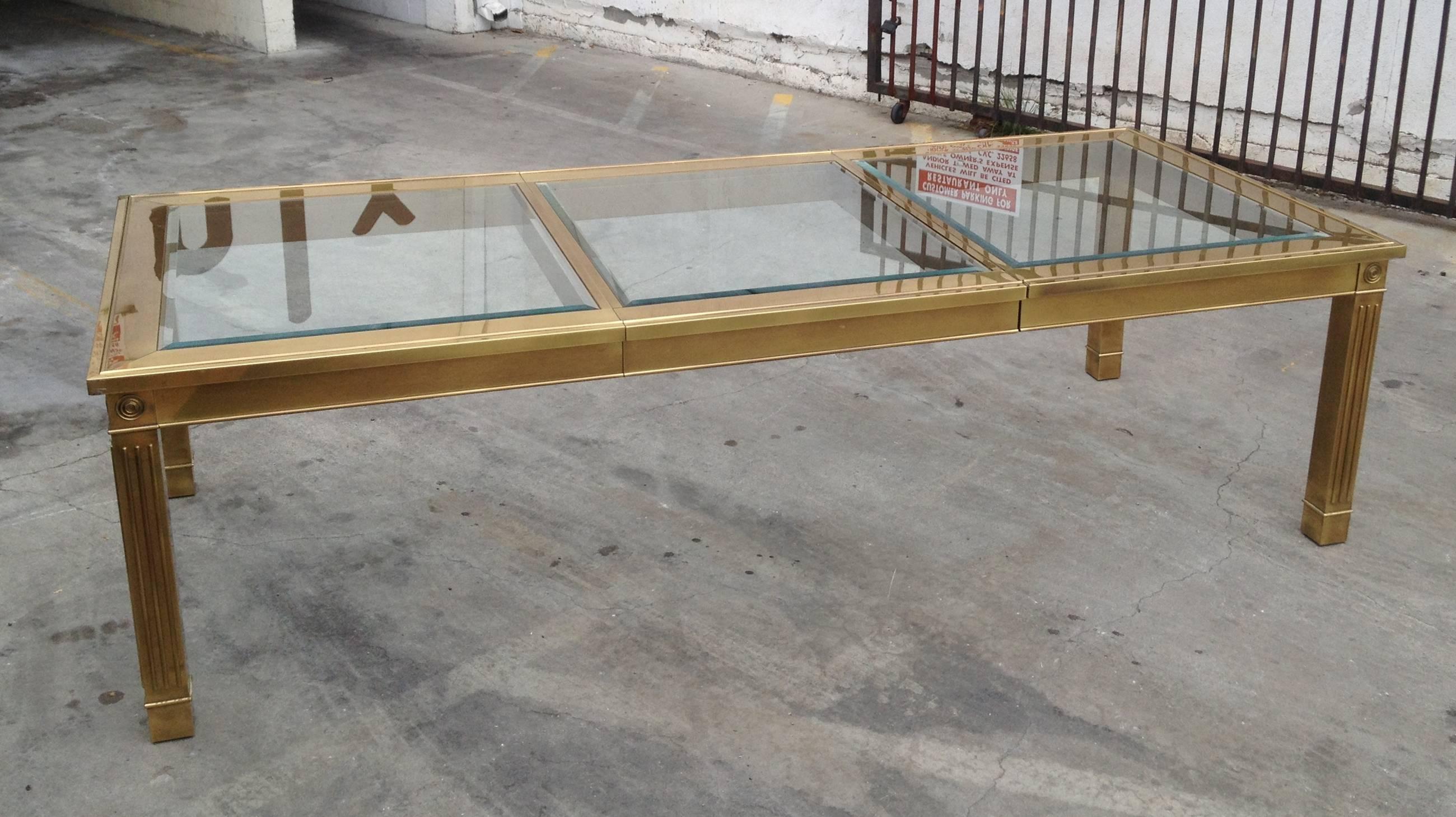 Amazing brass and glass dining table by Mastercraft, manufactured in the 1970s, the table comes with one 33
