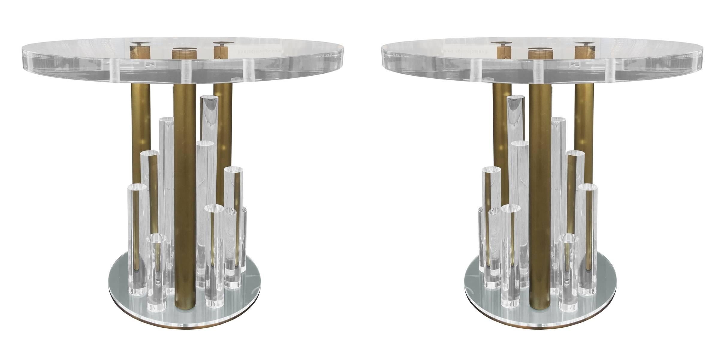 Beautiful set of side tables in Lucite and brass designed and manufactured by Charles Hollis Jones in the early 1970s.
These 