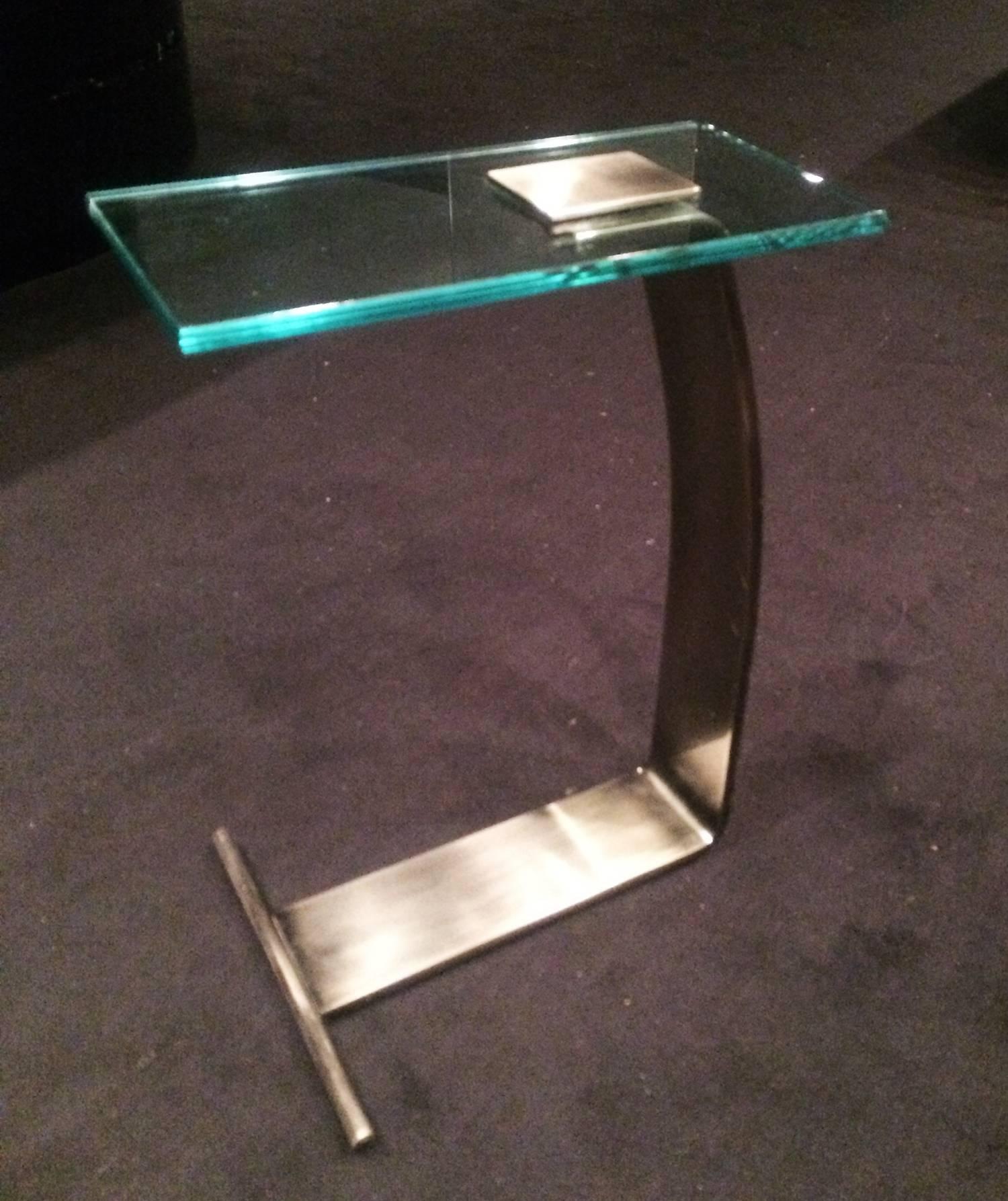 Beautiful nickel and glass cantilevered side table by Design Institute of America.
The table was originally purchased in the early 1970s and it remained at the same house until recently.

The table came out of NY estate and is in excellent