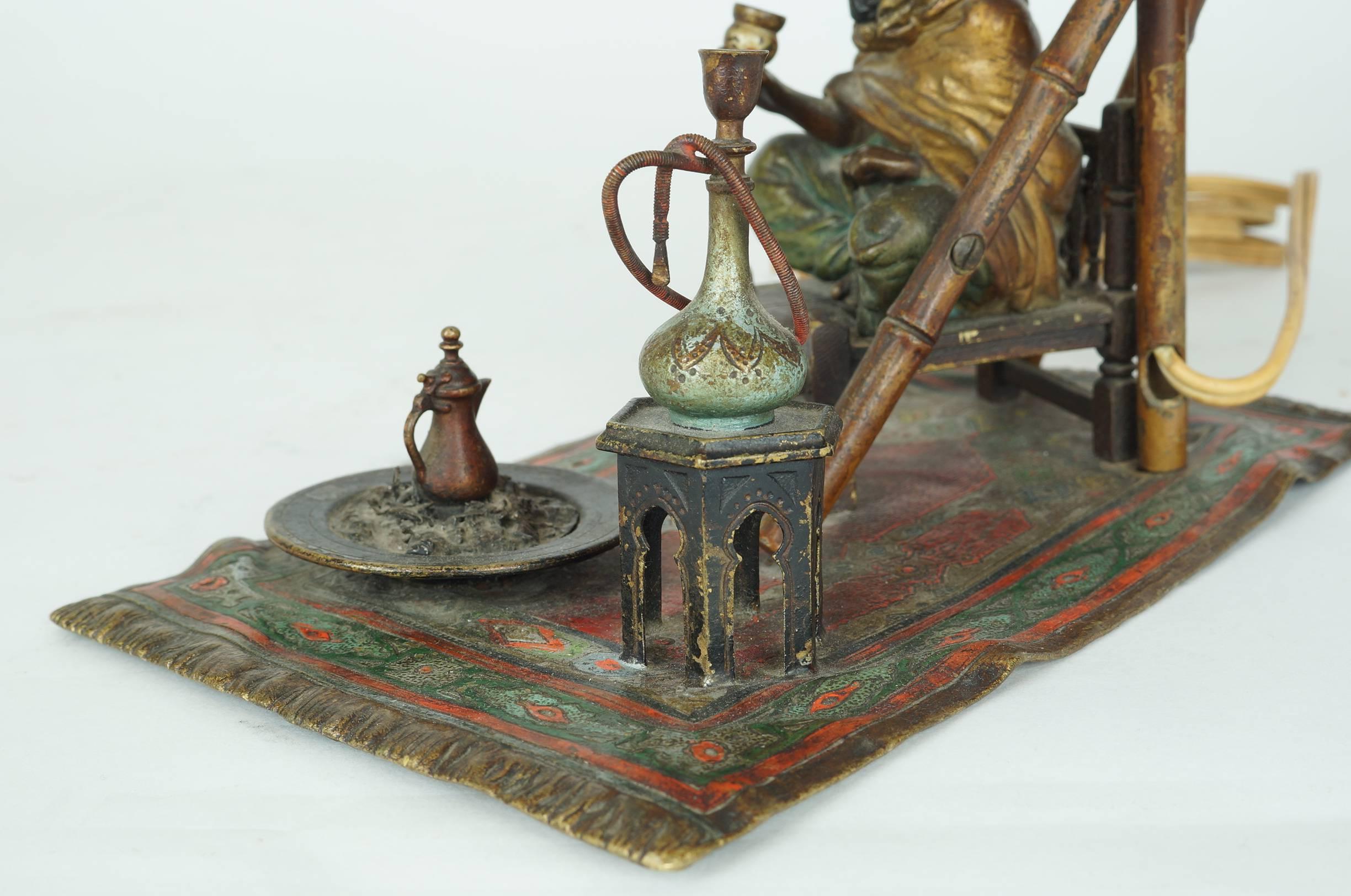 19th Century Bronze Bergman Lamp of a Seated Man on Chair Having Coffee For Sale