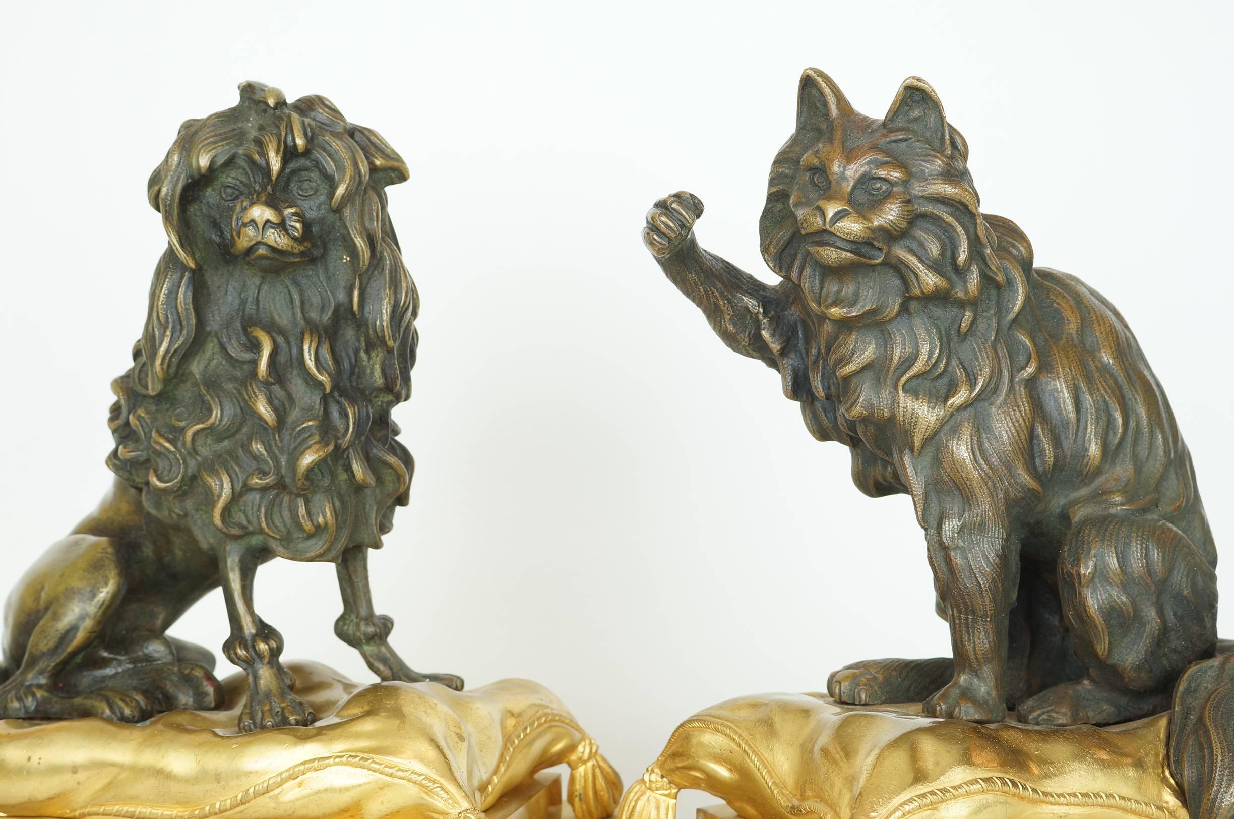 Large pair of bronze dog and cat figural fireplace chenets, each patinated bronze figure seated on gilt bronze pillow shaped bases.
Stock Number: MF19
