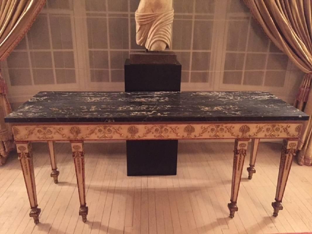 Finest quality Empire style cream painted parcel milt marble top console table, French, circa 1900.
Measurements: 74 1/2