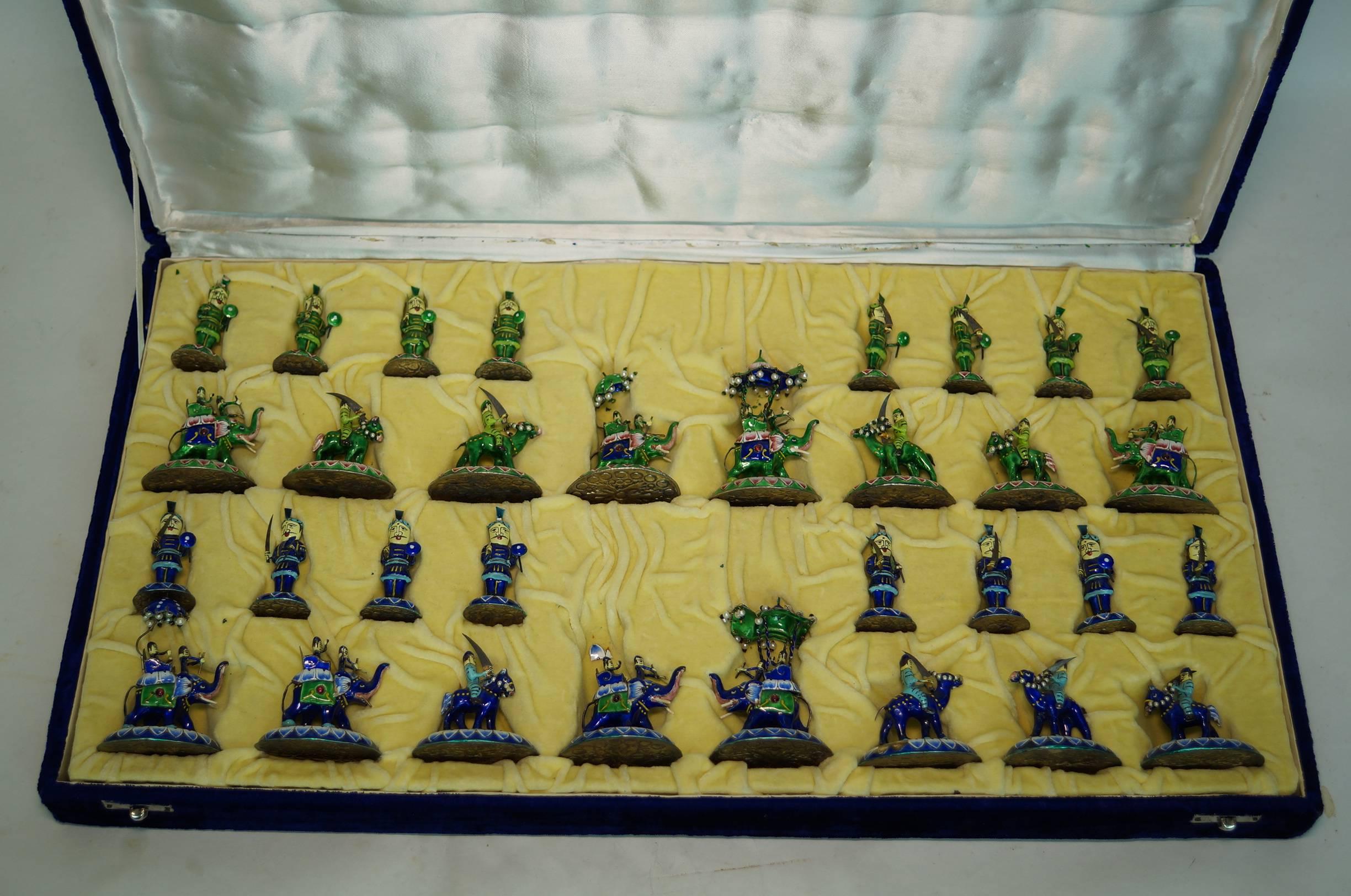 Fine and complete blue and green enamel chess set in original box.
