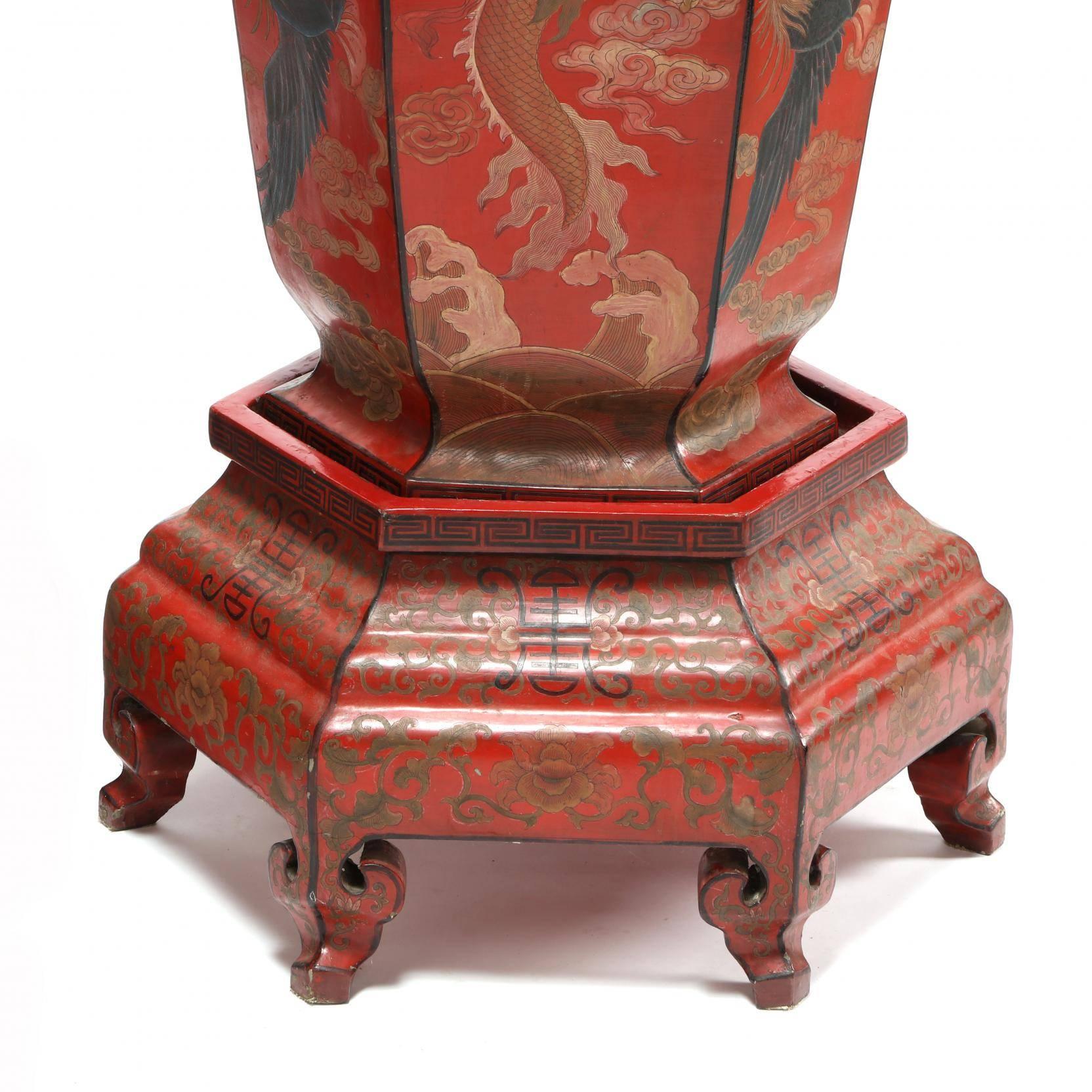 Large pair of Chinese red lacquer imperial vases with painted dragon on stands.

Qing dynasty (1644-1912), 19th century, exceptionally large pair of Chinese palace or imperial vases, hexagonal sided vases with alternating panels that feature