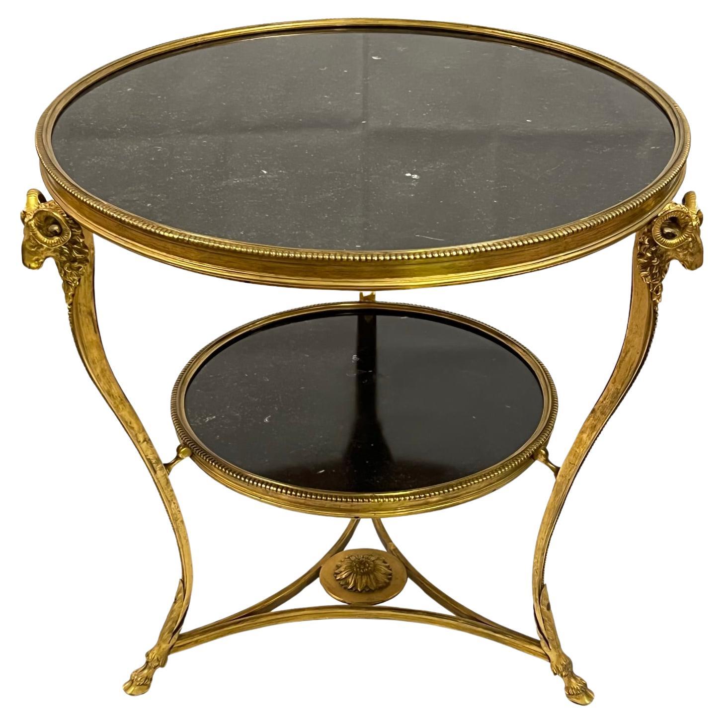 Tavolo Gueridon neoclassico in bronzo dorato con piano in marmo color carbone