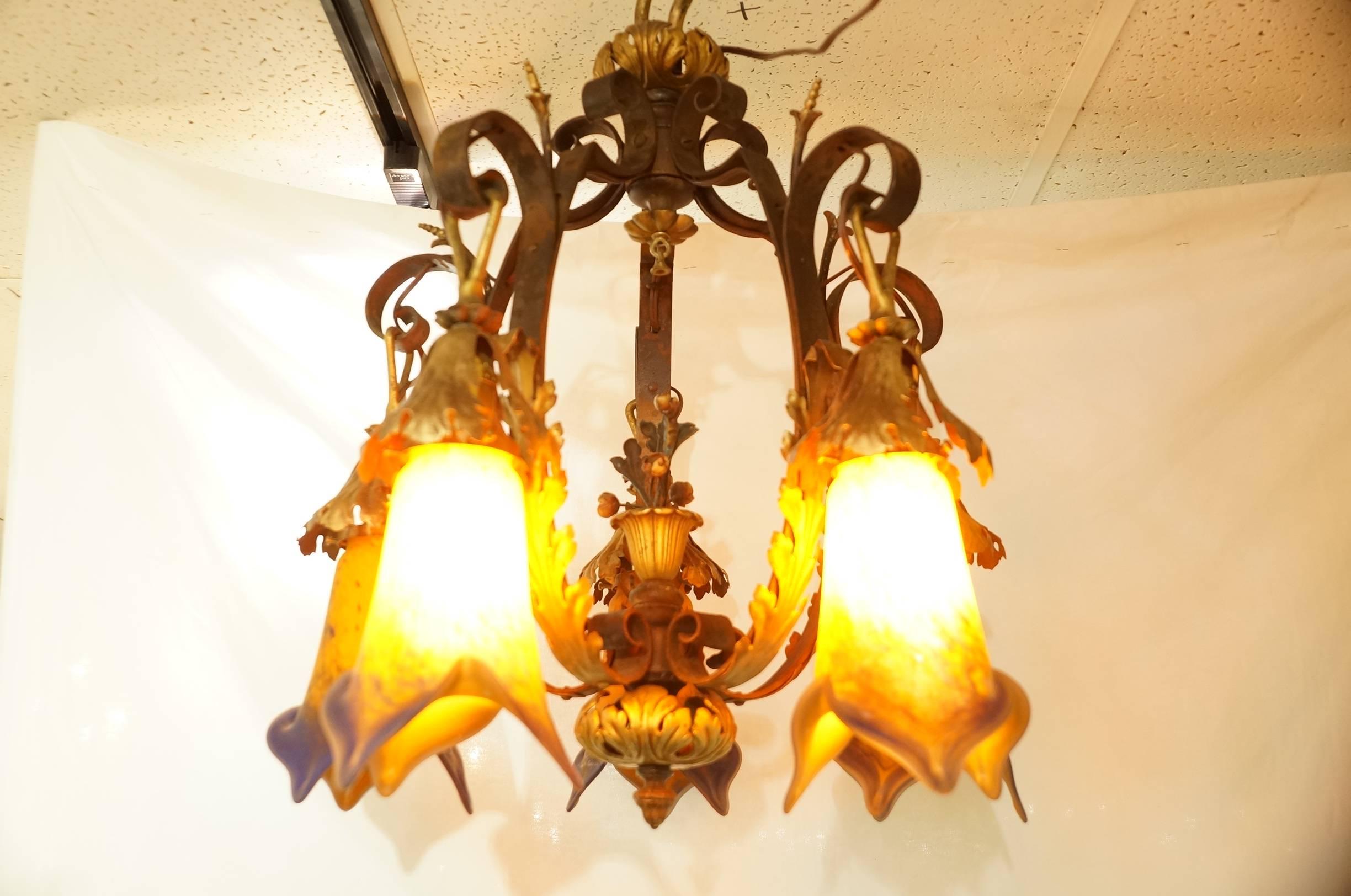 An Art Nouveau 5 Arm Bronze Chandelier with Colored Glass Shades in Daum Nancy Style
Stock Number: L376