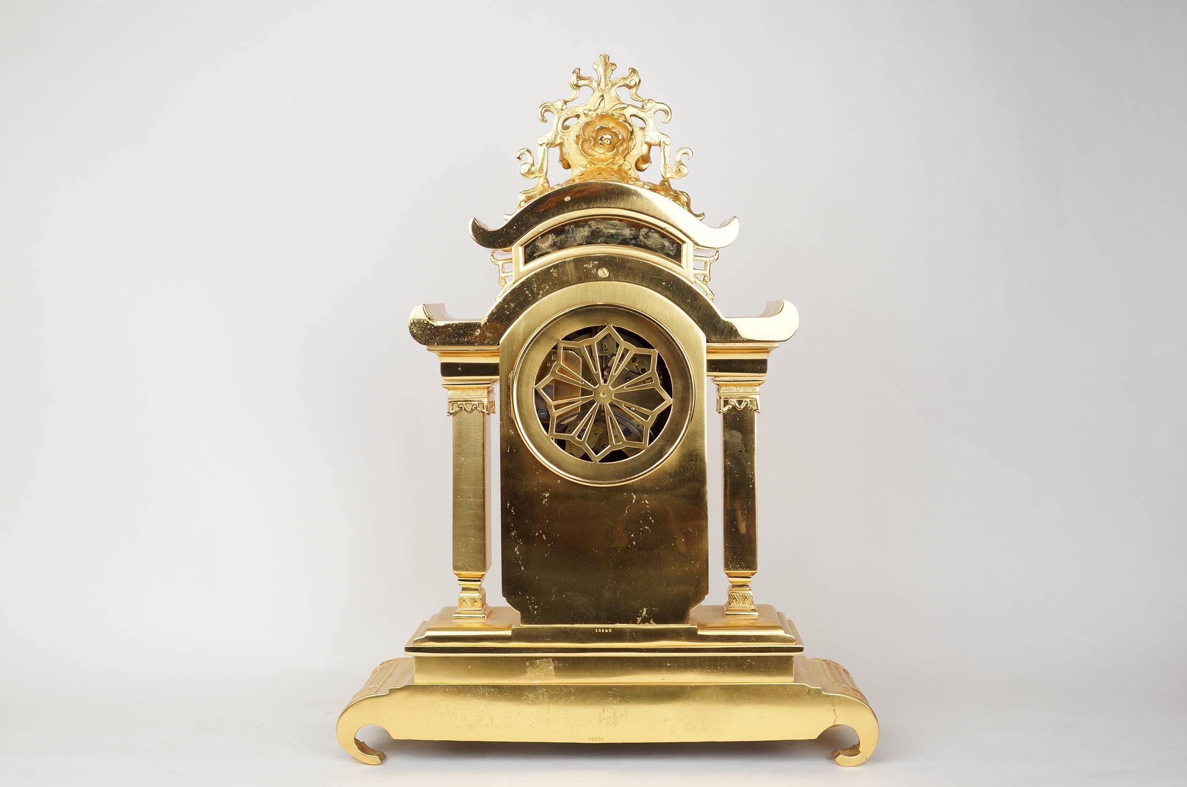 Important Oriental Japonism style French gilt bronze two toned mantel clock set made for the oriental market with gilt bronze dragon handles and elephant figure on top with forest scene motif with birds and trees.
The two side pieces can be used as