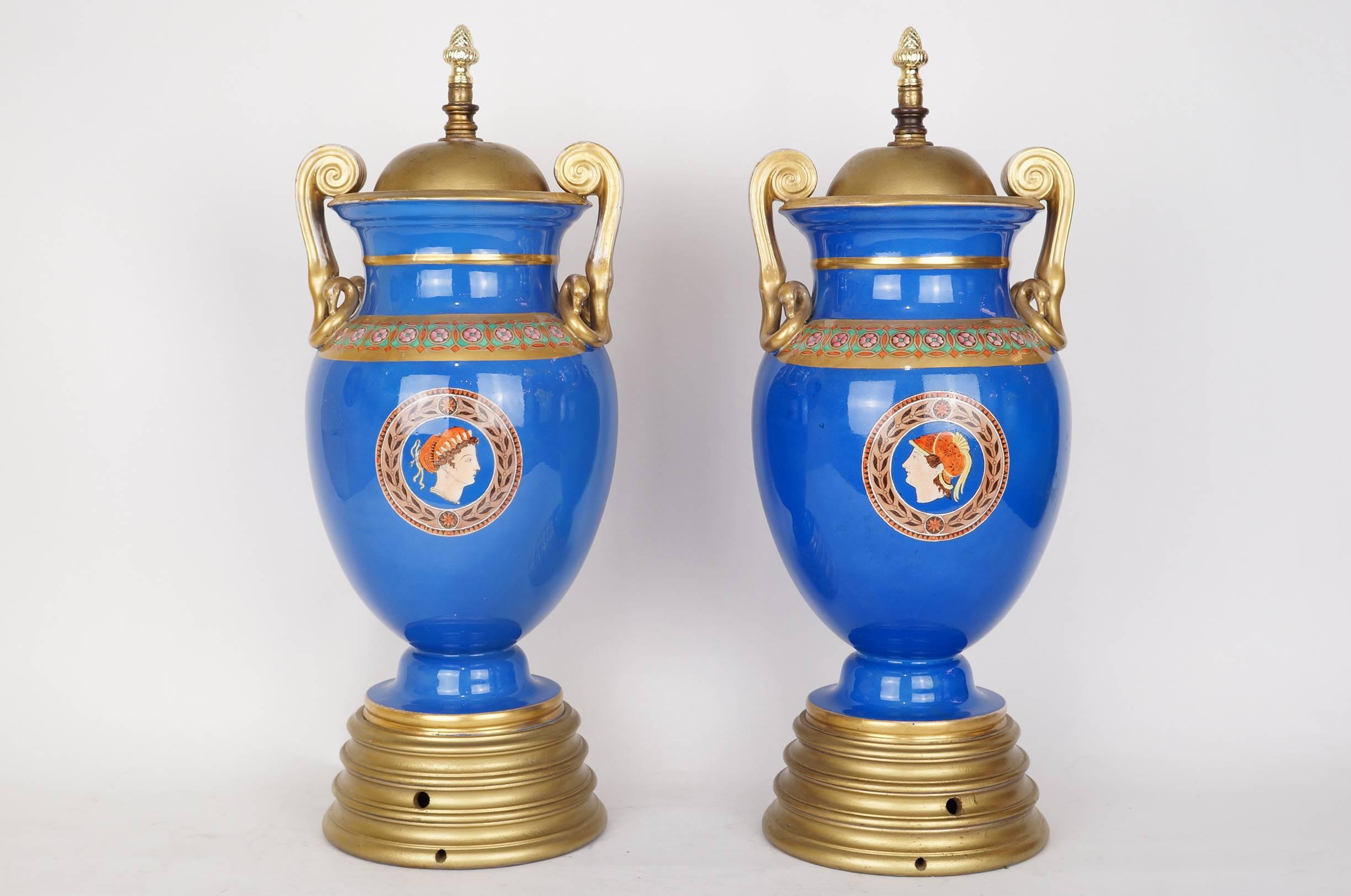 Pair of Neoclassical Painted Blue Porcelain Lamp Bases with Chariots Scenes on Round Gilt Bases
Stock Number: L378