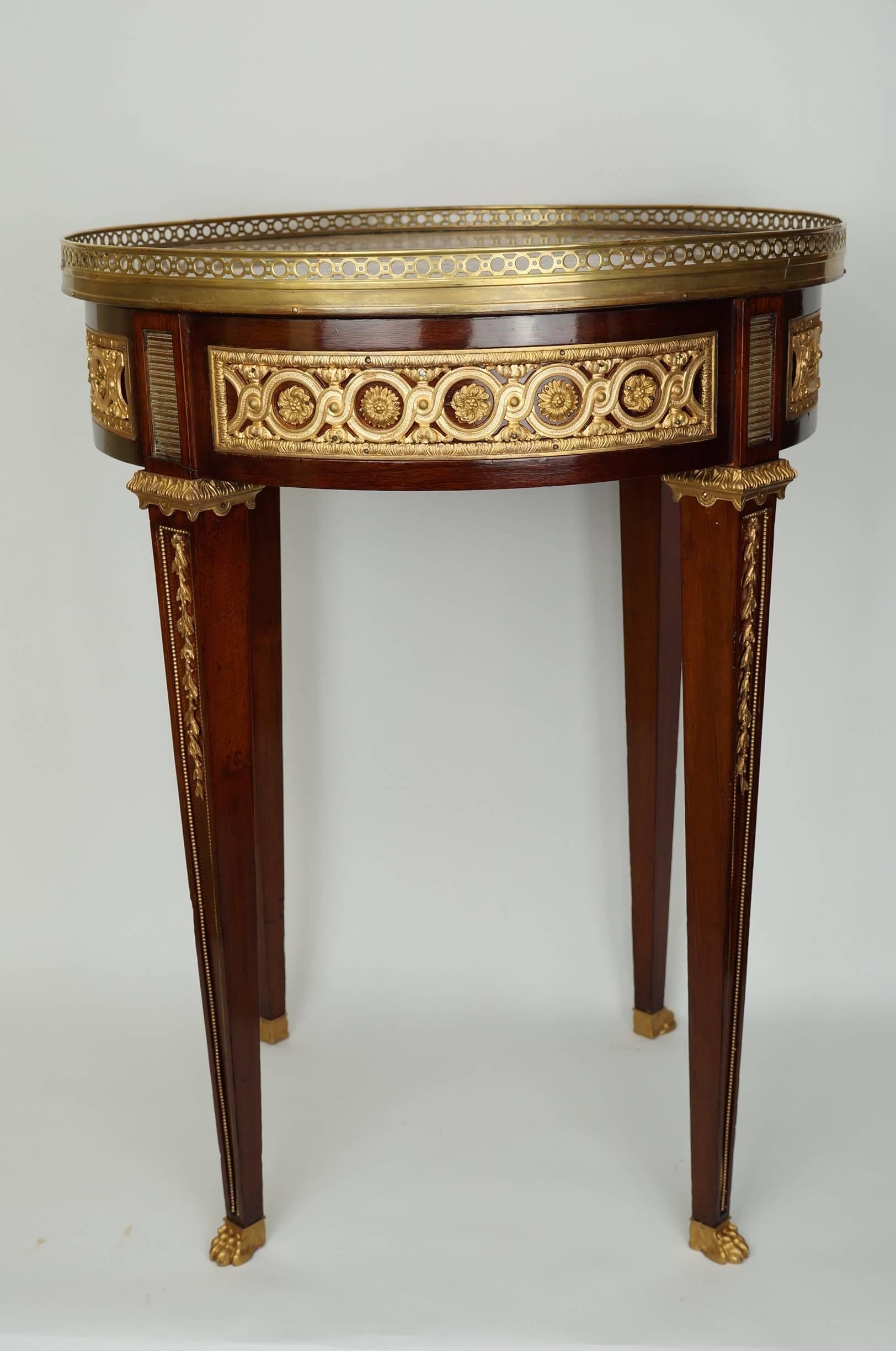 A Fine Pair of French Louis XVI Style Marble Top Gueridon Side Tables with Gilt Bronze Mounts and Paw Feet