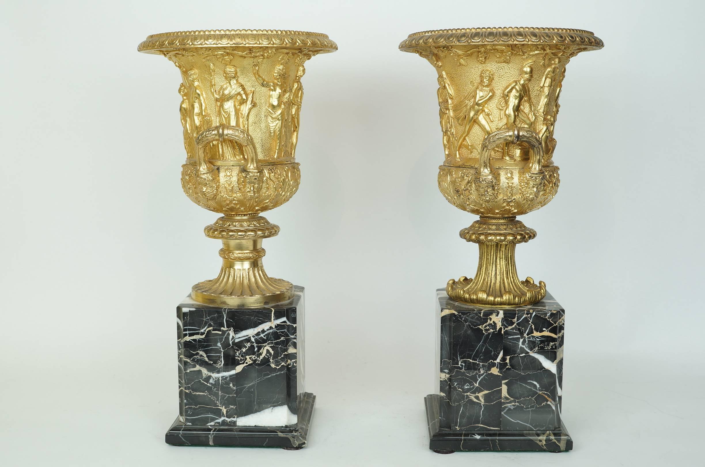 Pair of Neoclassical Gilt Bronze Figural Medici Style Urns on Marble Base 
Stock Number: DA129