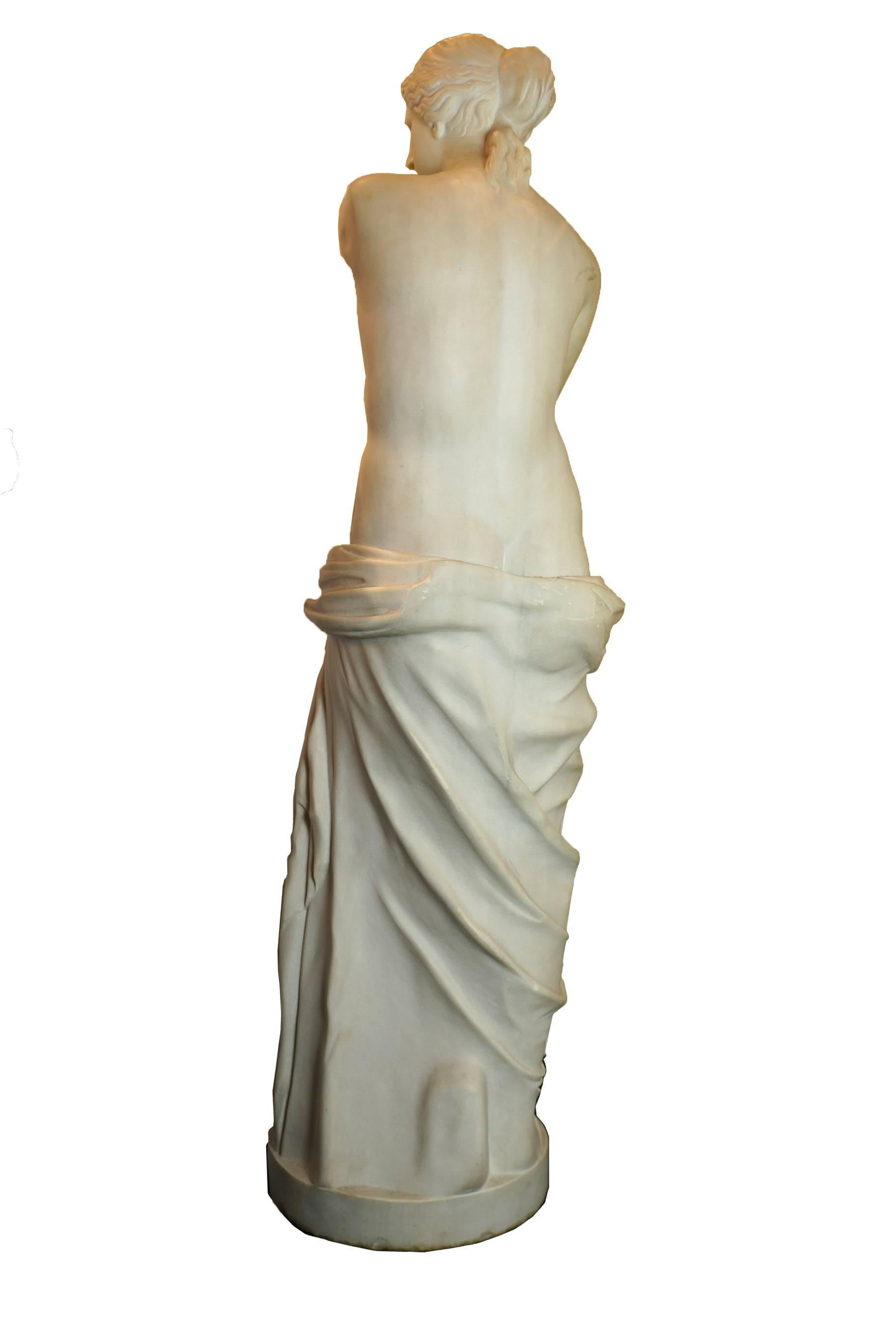 Carved Italian white marble figure of a neoclassical standing nude robed on the bottom part of her body.
Apparently unsigned.
Stock Number: SC108