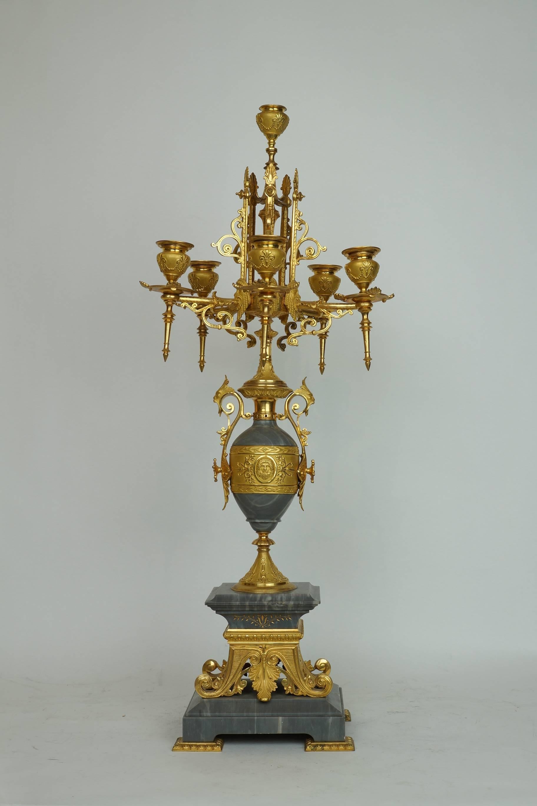 Pair of French 19th century candelabra of the finest quality in the Greek Revival style, exceptionally cast and gilt, with bleu turquin marble.